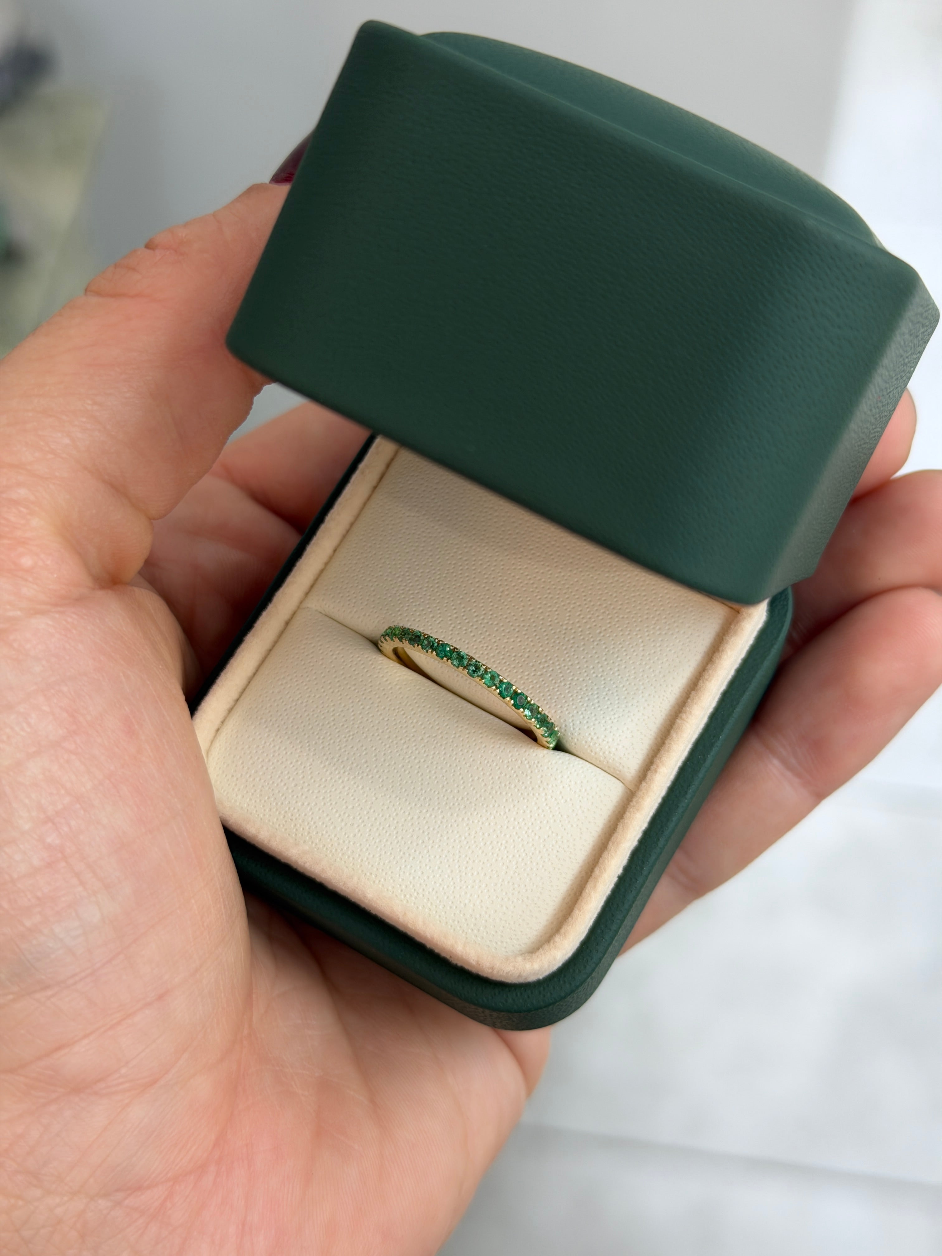 14K natural emerald eternity band with 0.70tcw from JR Colombian Emeralds, shown in size 6, 7, or 8.