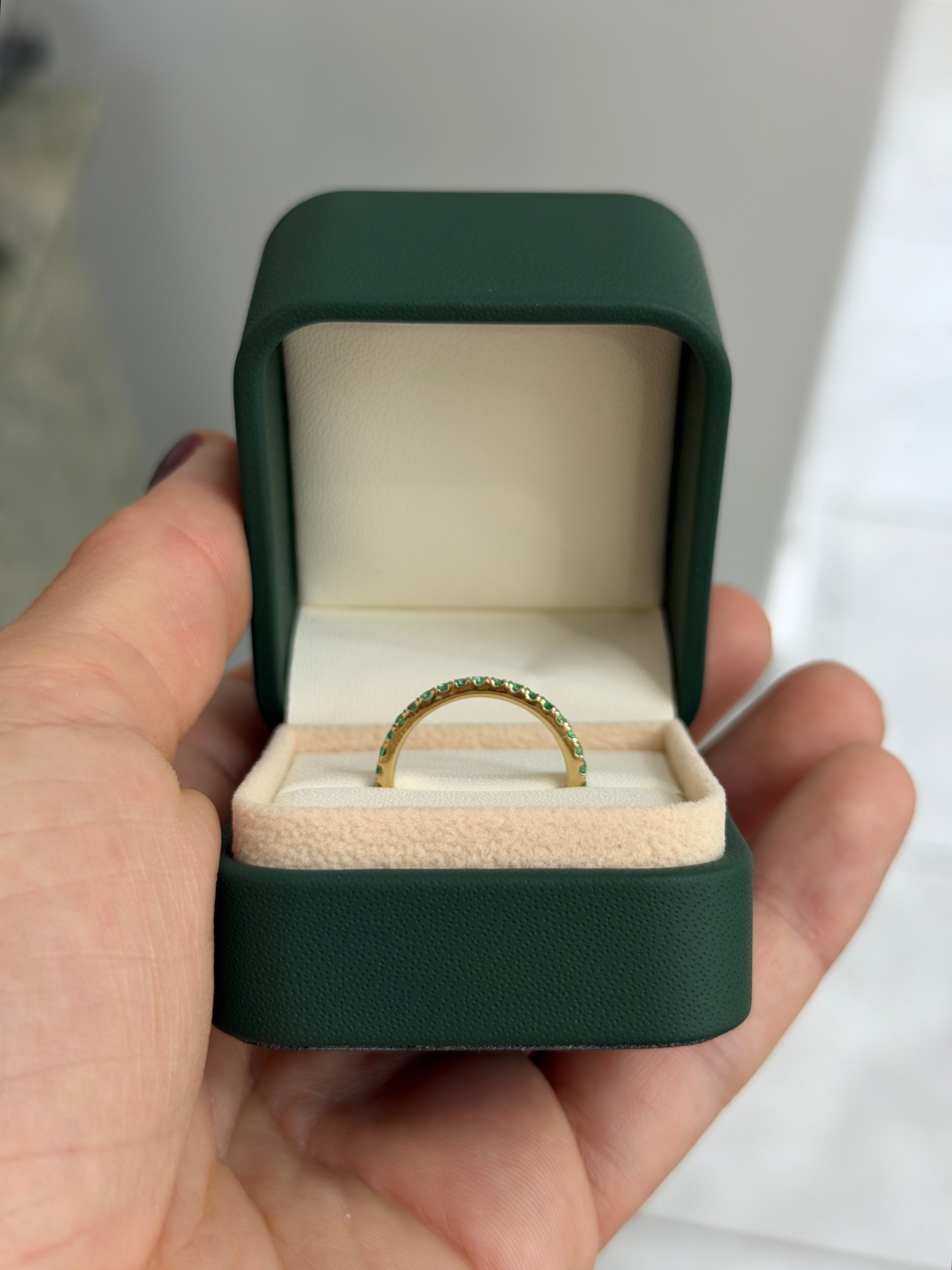 14K gold natural emerald eternity band with 0.70tcw from JR Colombian Emeralds, available in sizes 6, 7, and 8.