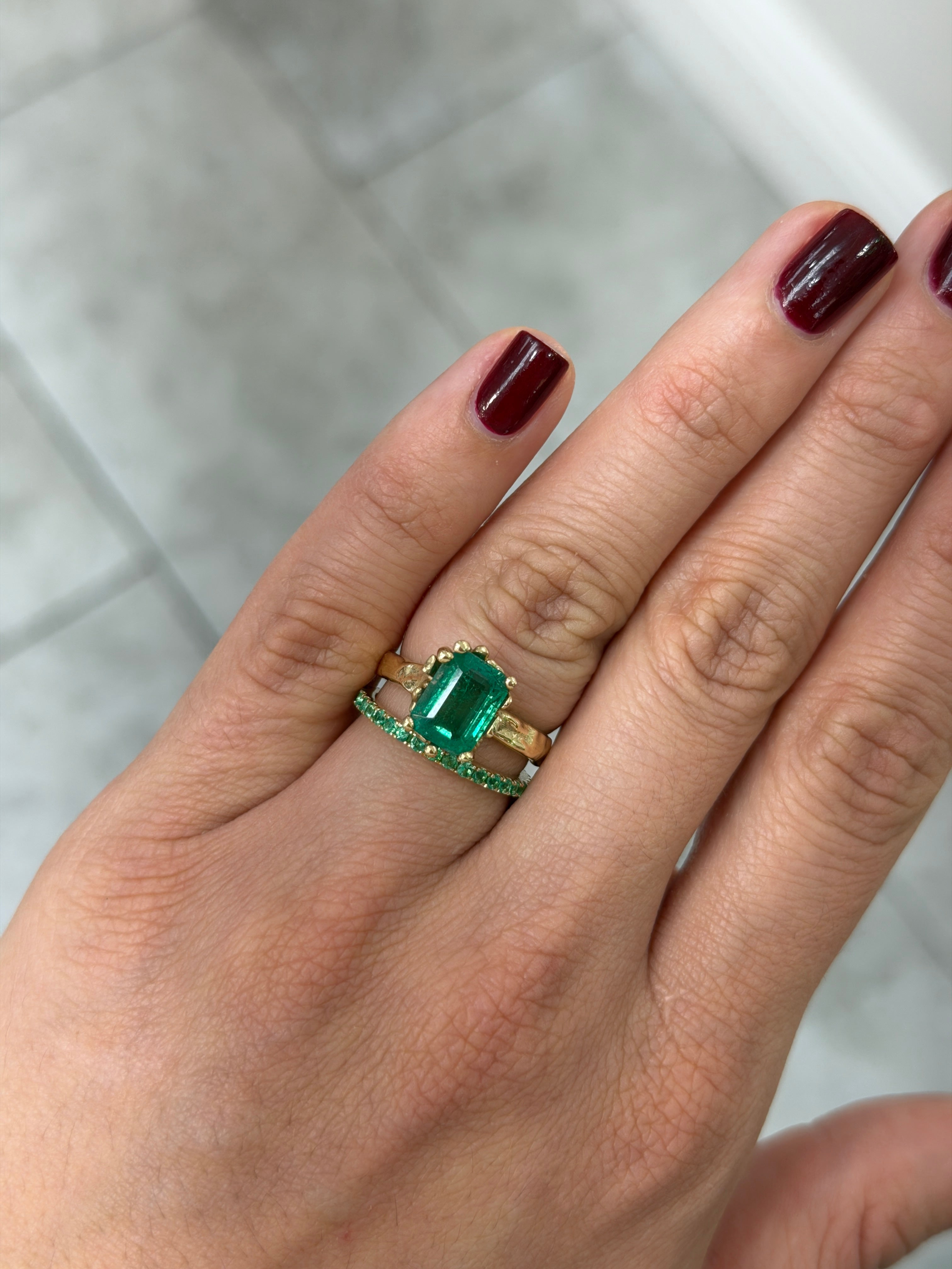 14K natural emerald eternity band with 0.70tcw gemstones in sizes 6, 7, and 8, showcasing sparkling green emeralds from JR Colombian Emeralds.
