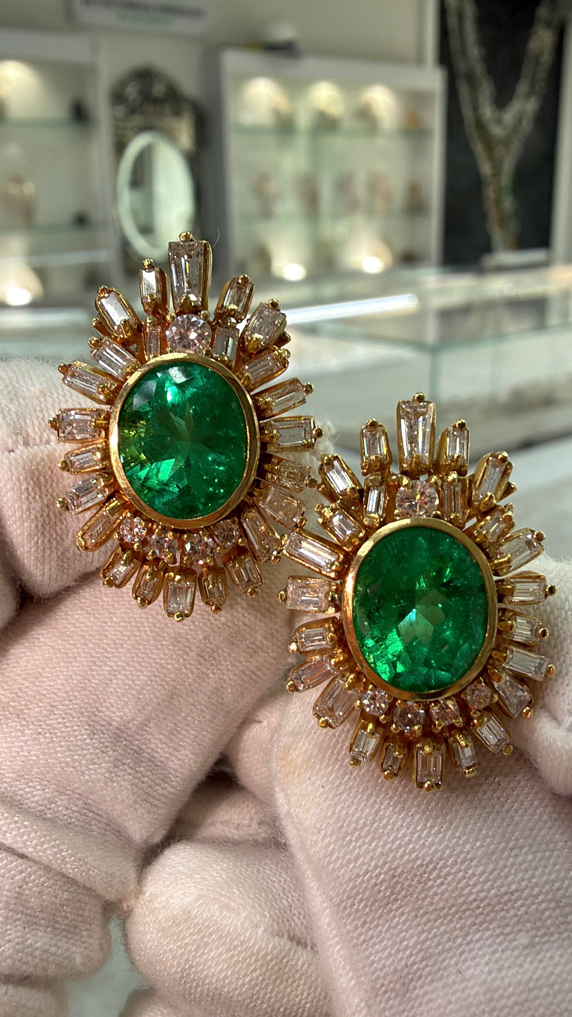 JR Colombian Emeralds 12.20tcw AAA+ oval Colombian emerald and diamond statement earrings with intricate gold settings and sparkling stones.