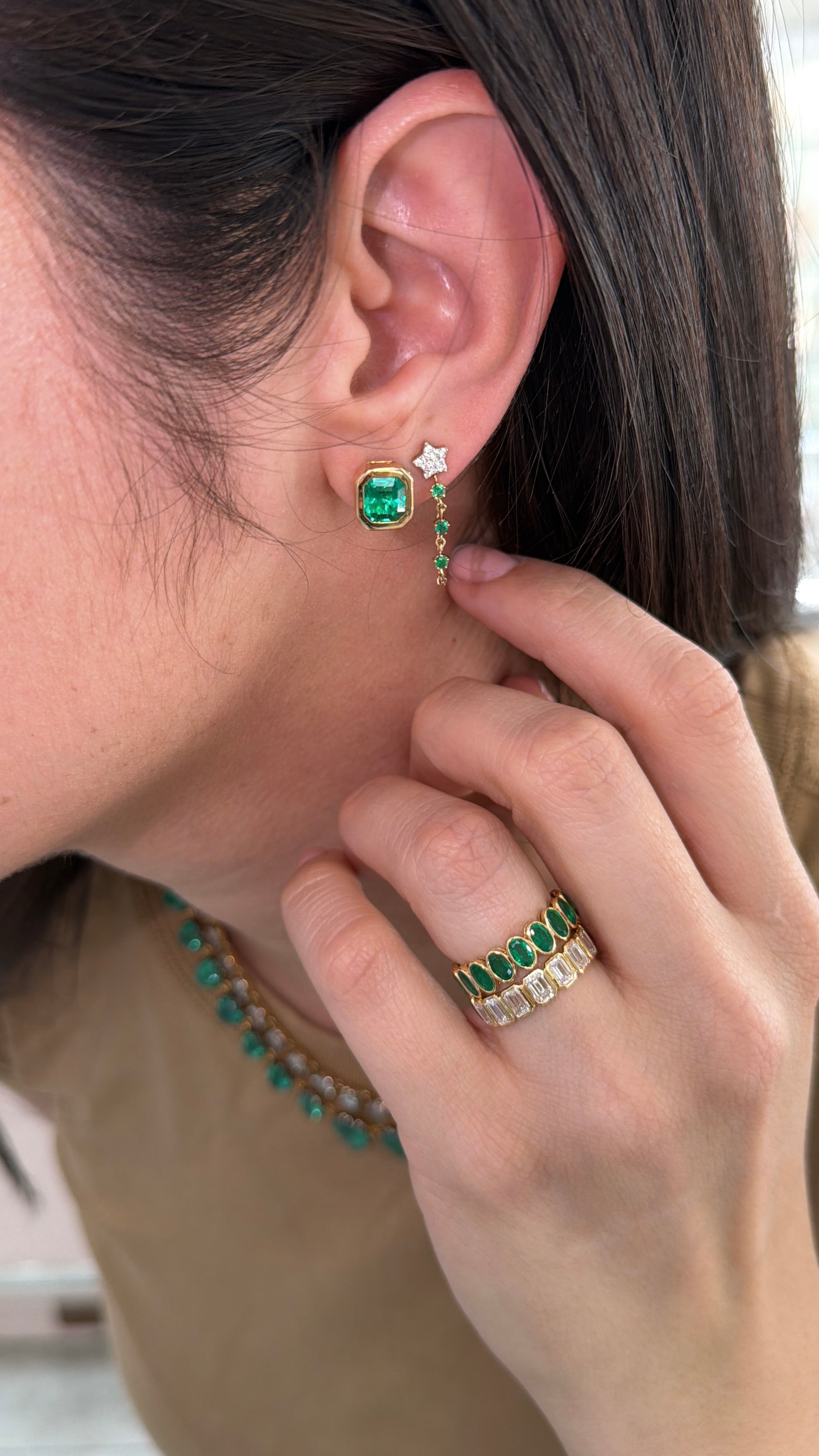 Emerald diamond star dangle earrings in 14K gold with rich green emeralds and sparkling diamonds from JR Colombian Emeralds.