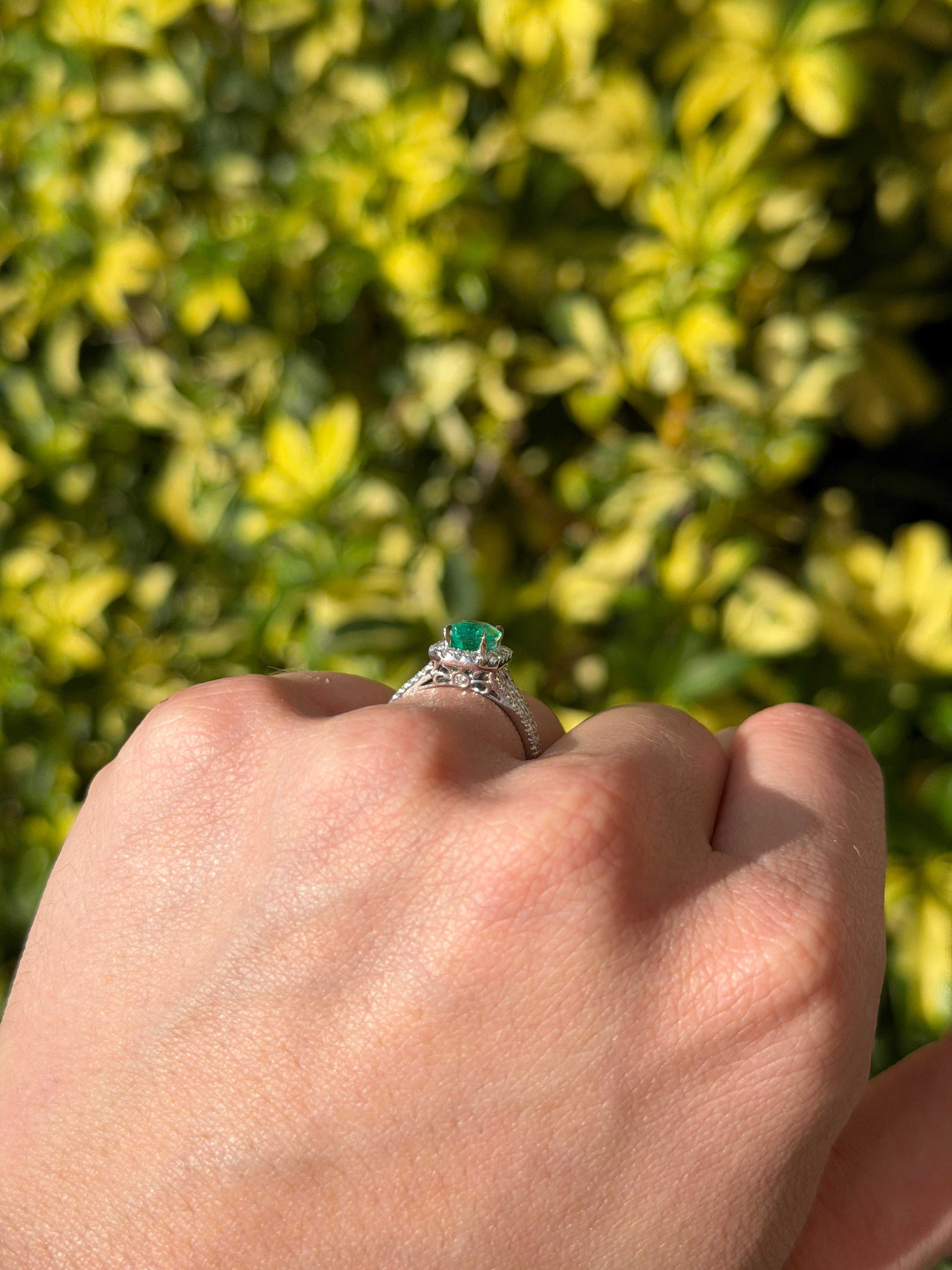 2.21tcw Chivor bluish green Colombian emerald engagement ring with diamond halo in 14K gold, featuring intricate design details.
