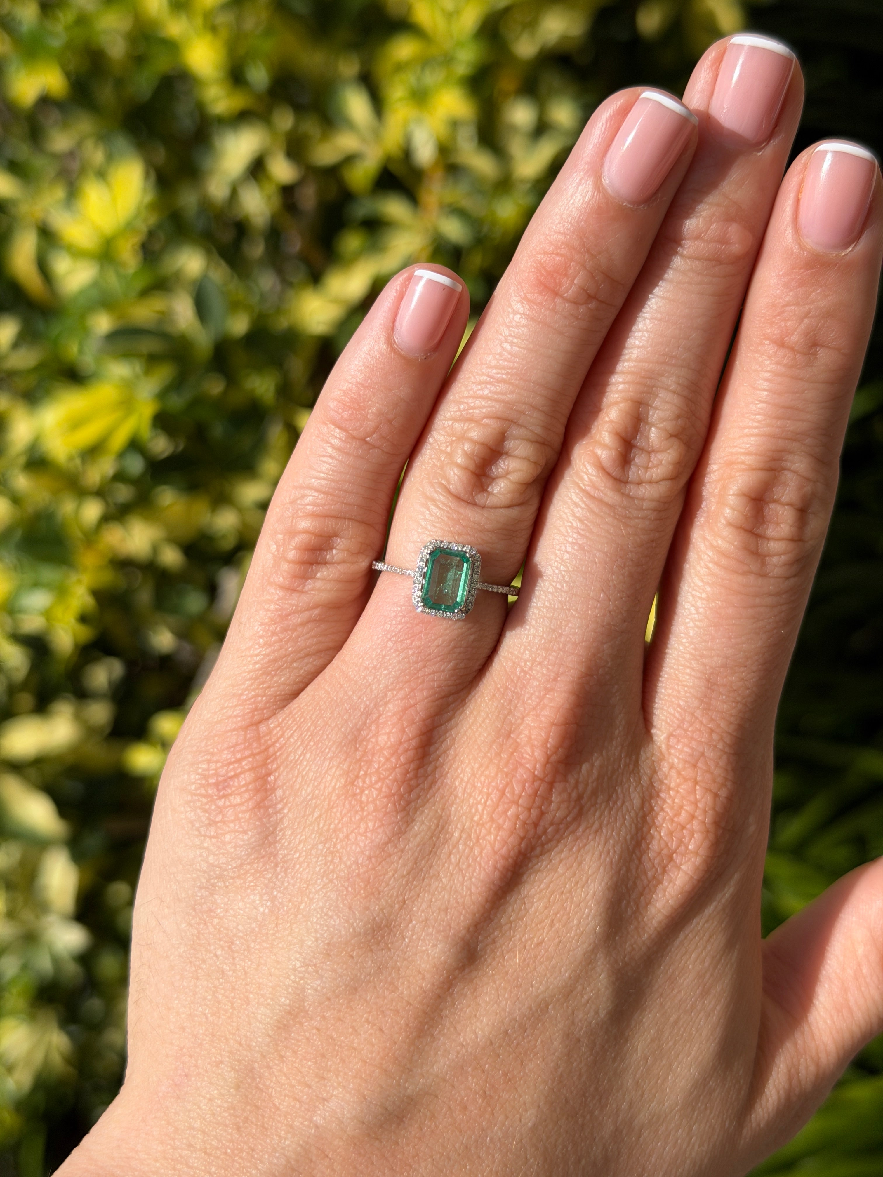 10x7.5mm emerald and diamond halo engagement ring in 14K white gold with crystal-clear stones, by JR Colombian Emeralds.