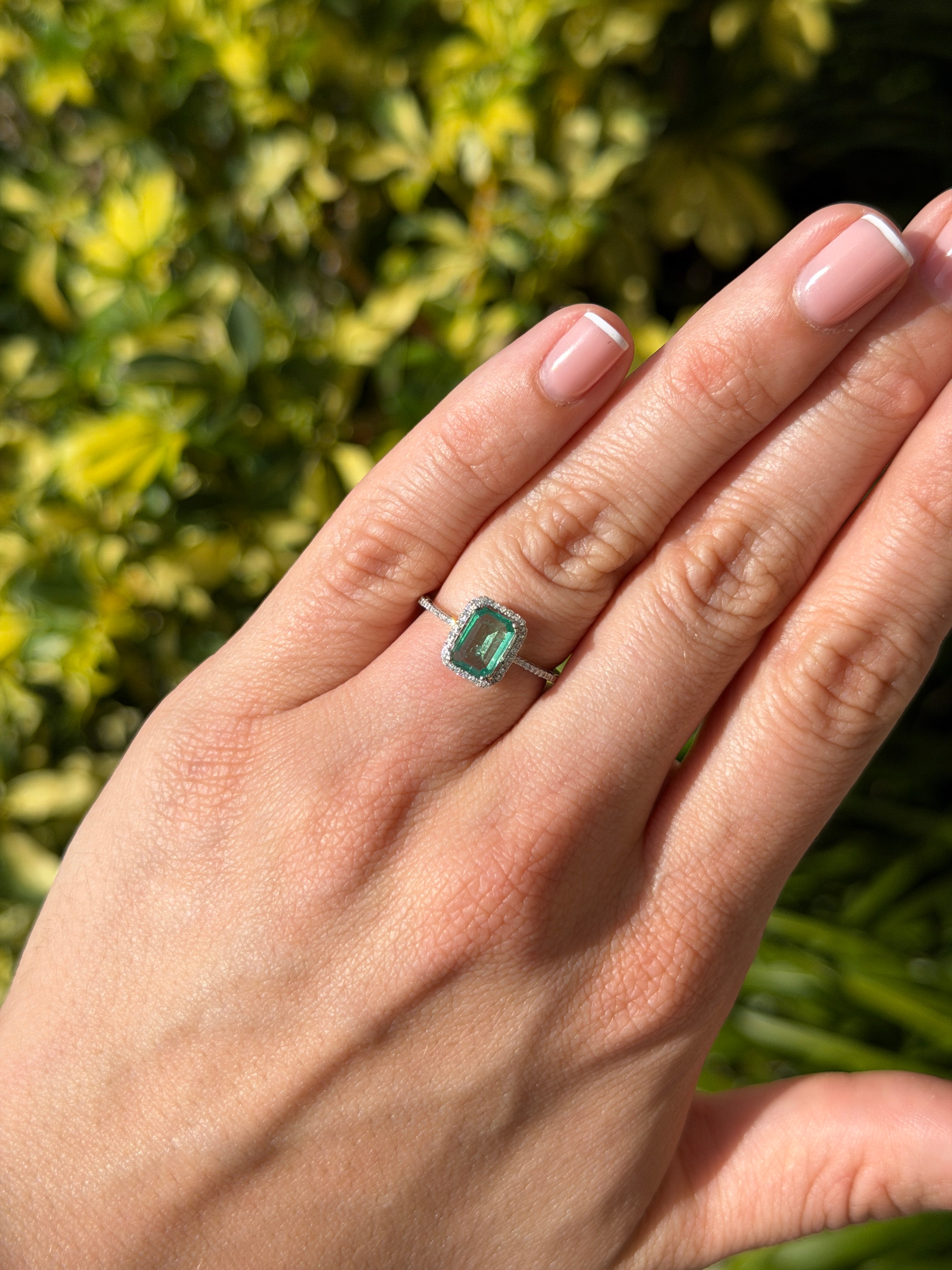 10x7.5mm emerald and diamond halo engagement ring in 14K white gold with clear crystal accents, by JR Colombian Emeralds