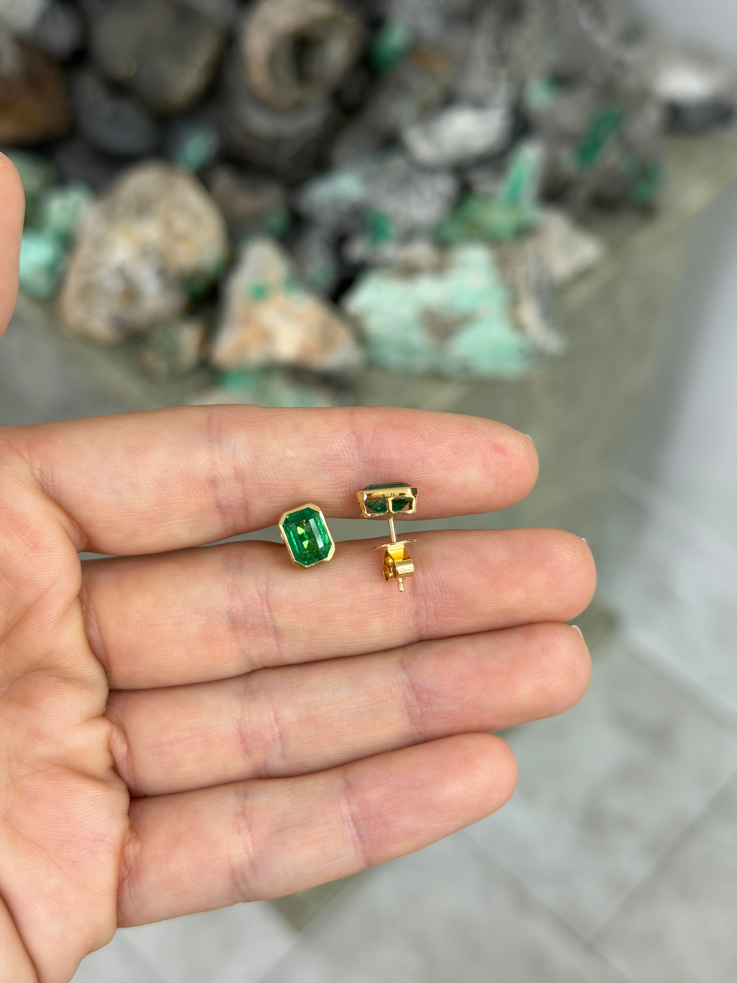 JR Colombian Emeralds 3.33tcw Angelina Jolie bezel set emerald stud earrings in 18K gold, featuring vibrant green emeralds.