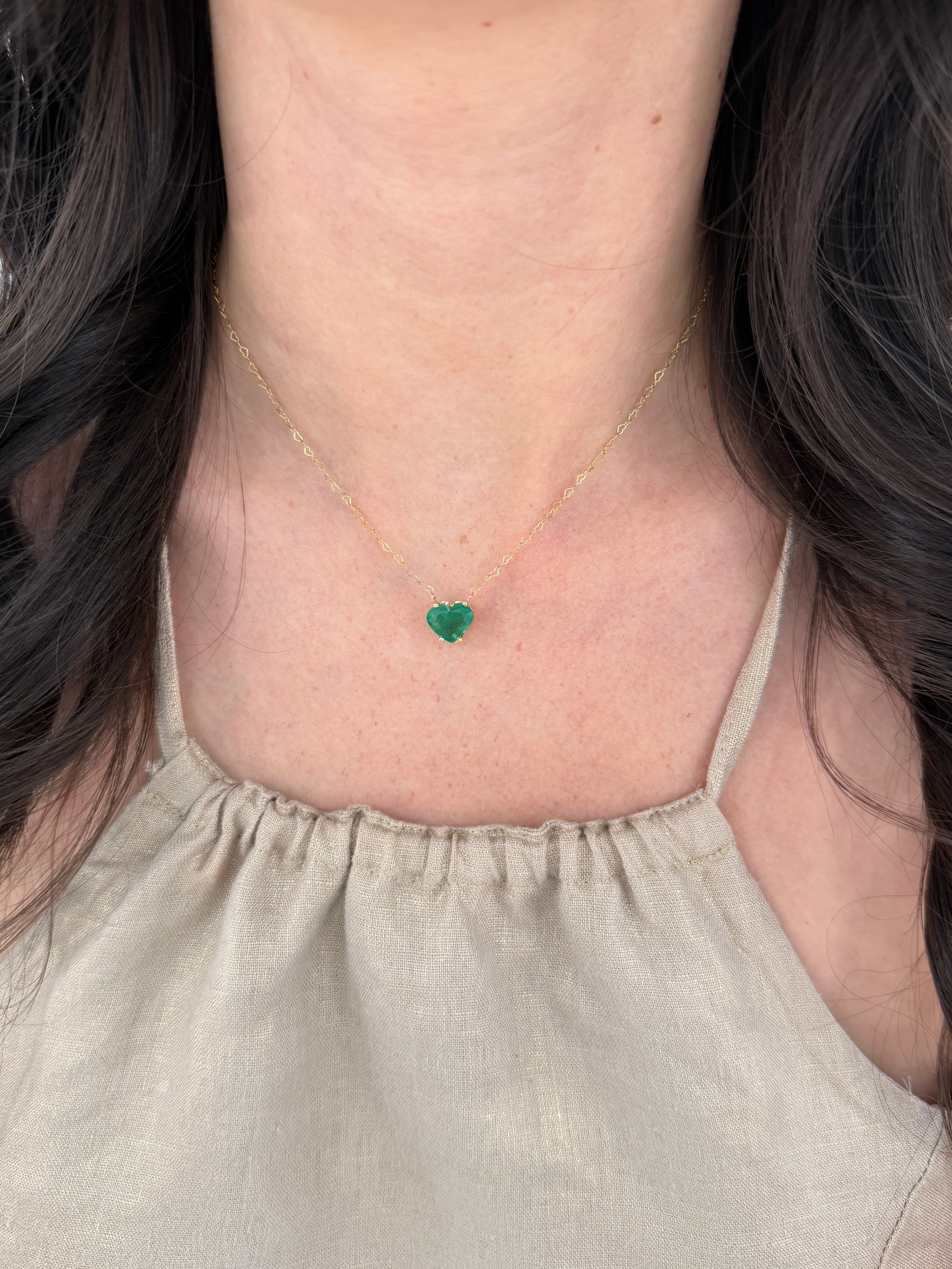 Natural Zambian emerald heart-shaped solitaire necklace featuring a 4.07-carat green gemstone, crafted by JR Colombian Emeralds.