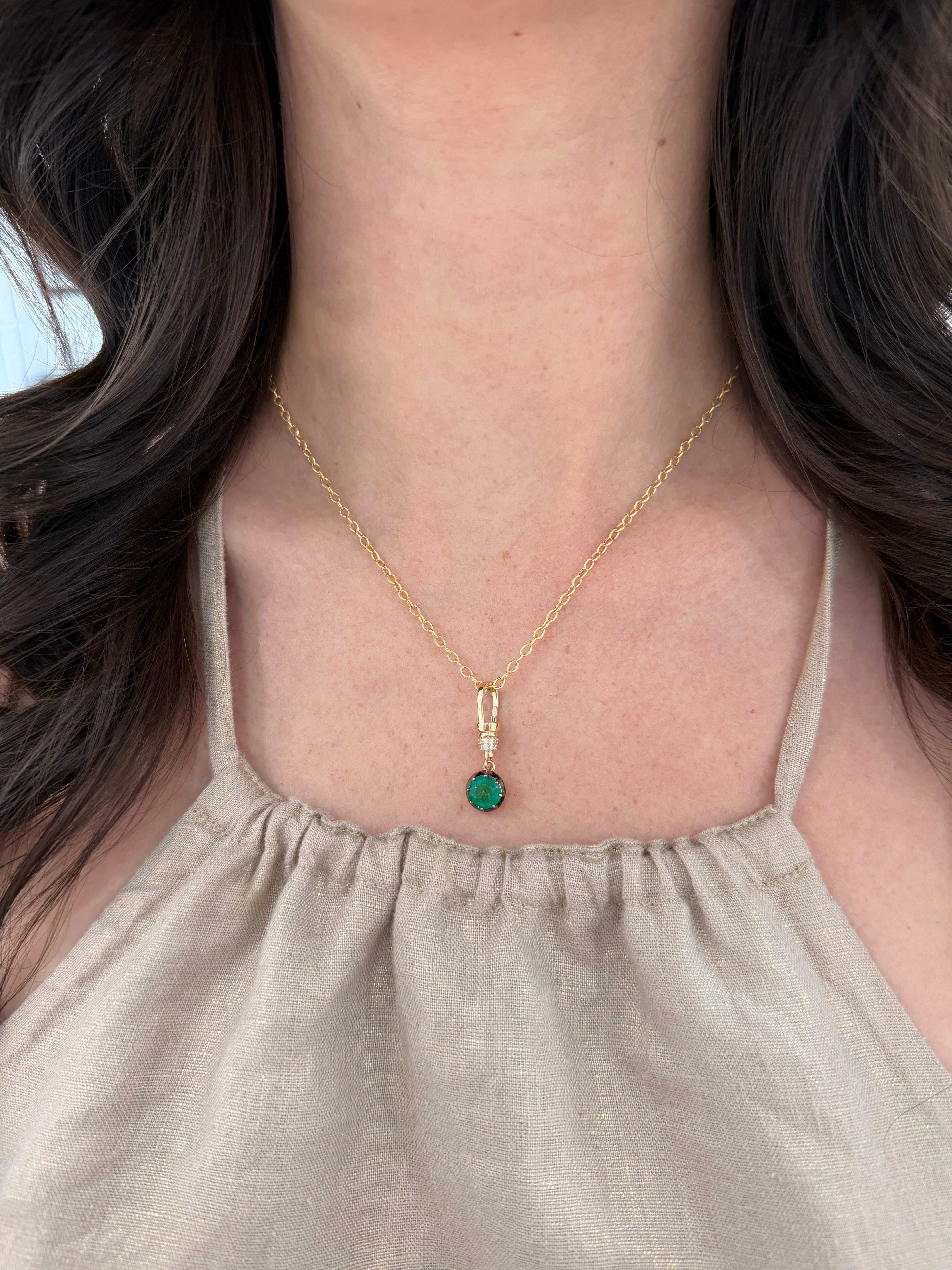 14K natural round cut emerald pendant with diamond accents on a necklace, featuring multi-prong setting by JR Colombian Emeralds.