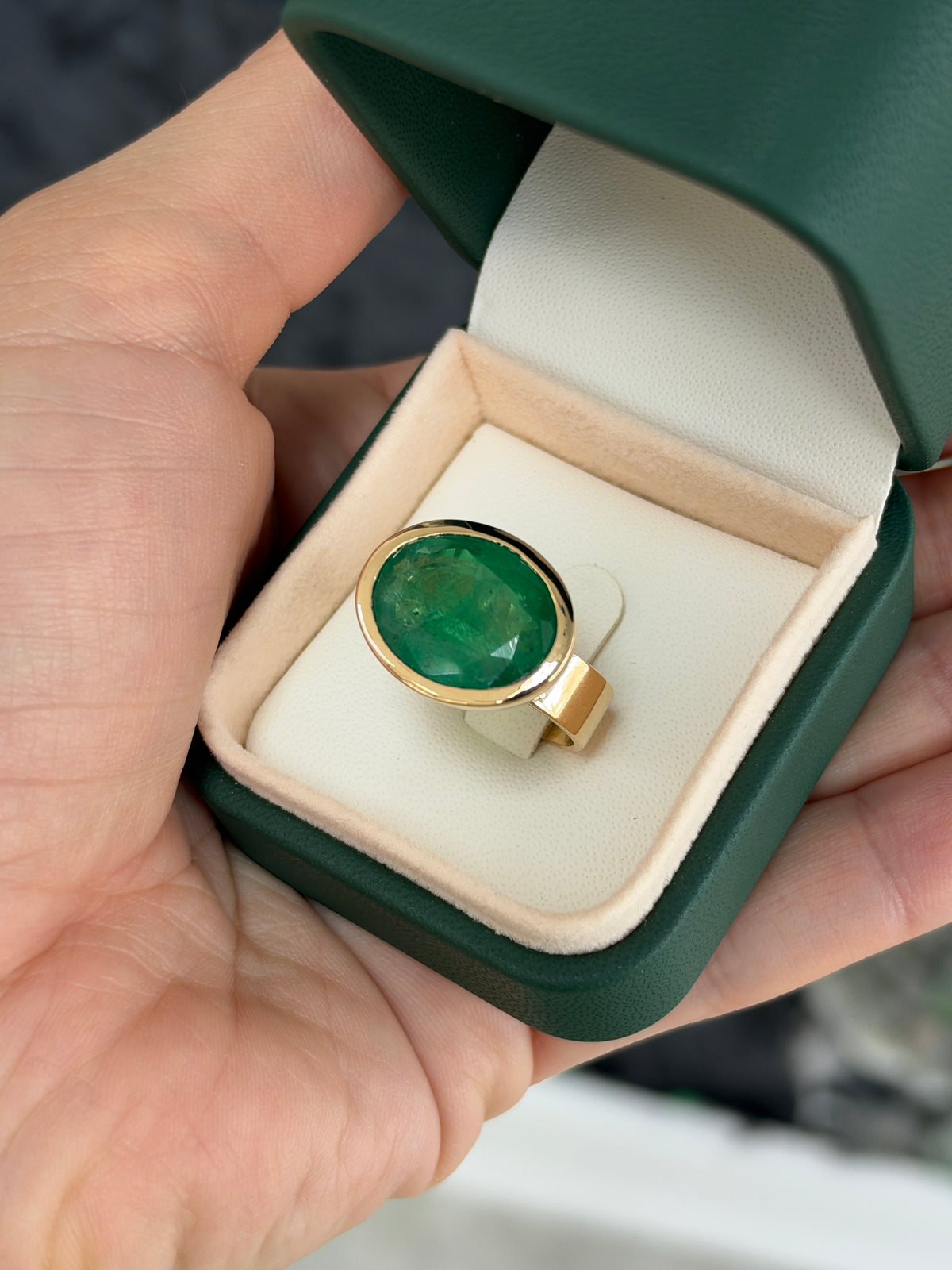 12.61ct 18K East to West Oval Emerald Bezel 5.7mm Wide Band Ring