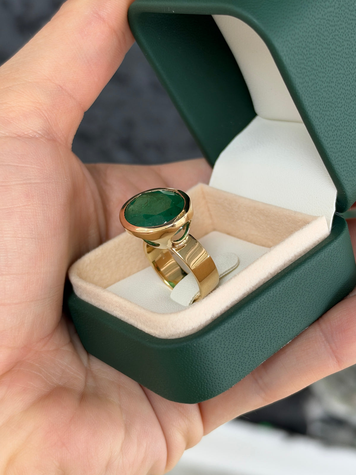 12.61ct 18K East to West Oval Emerald Bezel 5.7mm Wide Band Ring