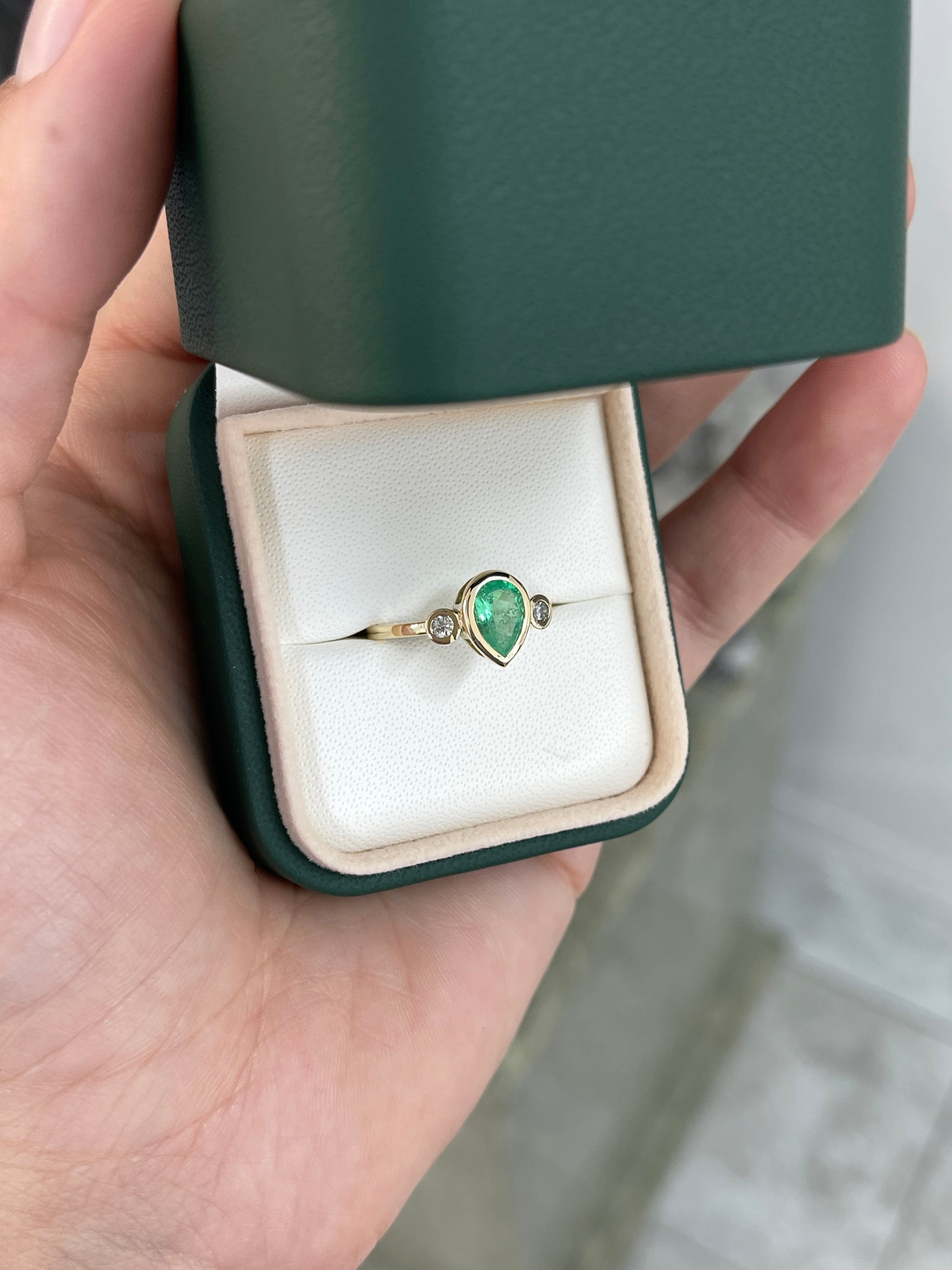 Bezel set 1.20tcw tear drop natural emerald and diamond three stone engagement ring in 14k gold by JR Colombian Emeralds