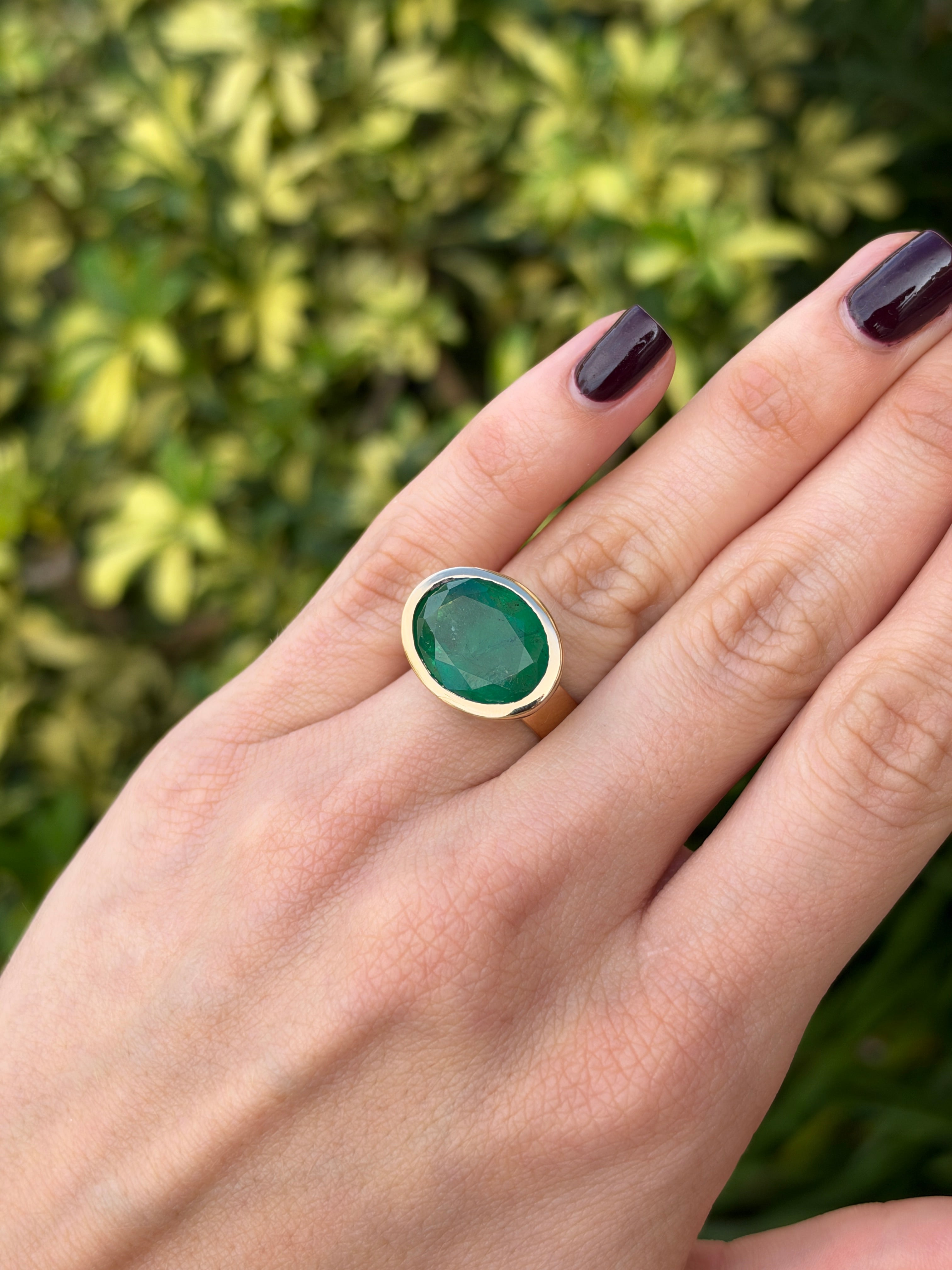 12.61ct 18K East to West Oval Emerald Bezel 5.7mm Wide Band Ring