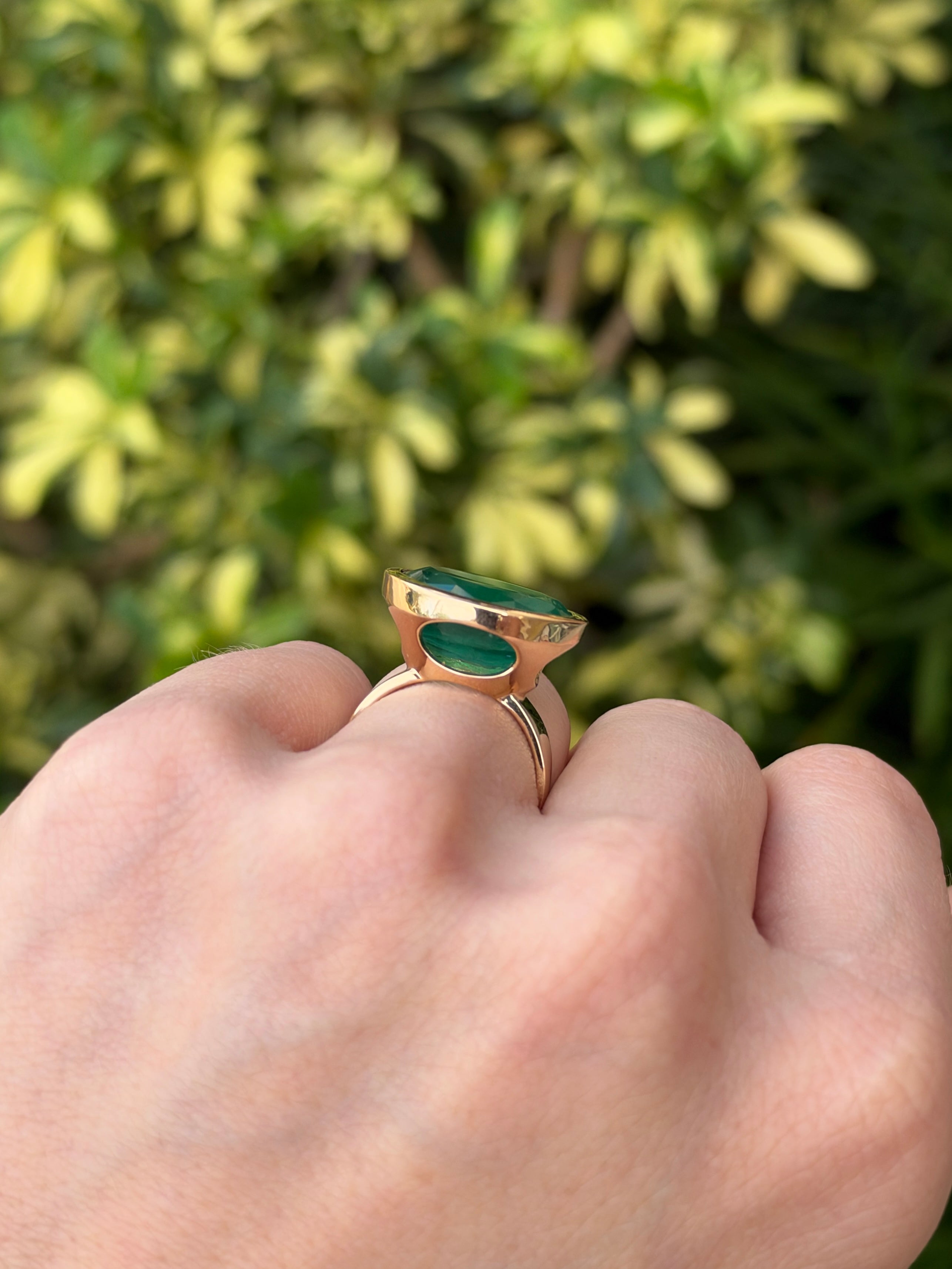 12.61ct 18K East to West Oval Emerald Bezel 5.7mm Wide Band Ring