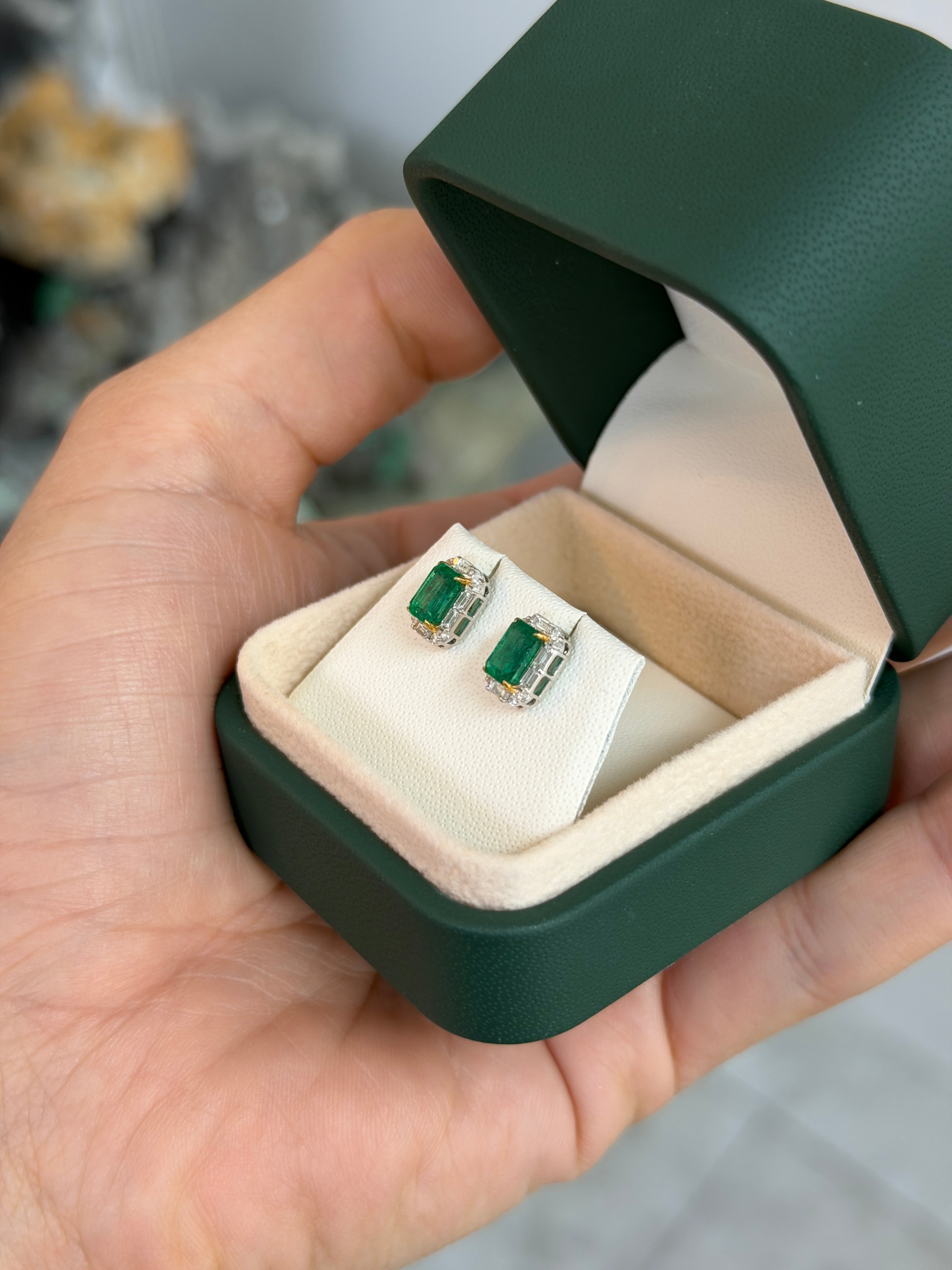 Natural emerald and baguette diamond halo stud earrings in 18K two-tone gold by JR Colombian Emeralds.