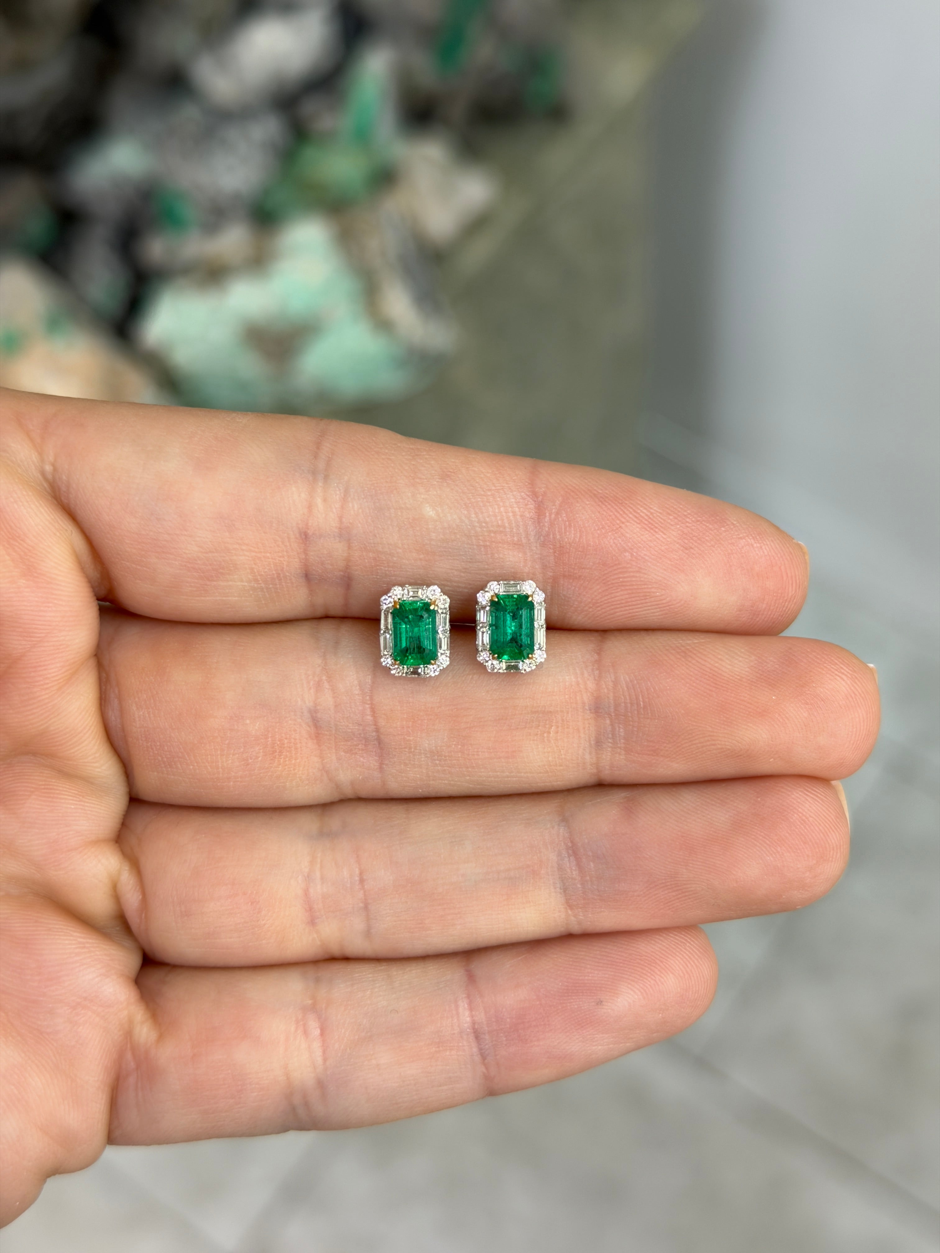 Natural emerald and baguette diamond halo stud earrings in 18K two-tone gold, featuring fine quality gemstones by JR Colombian Emeralds