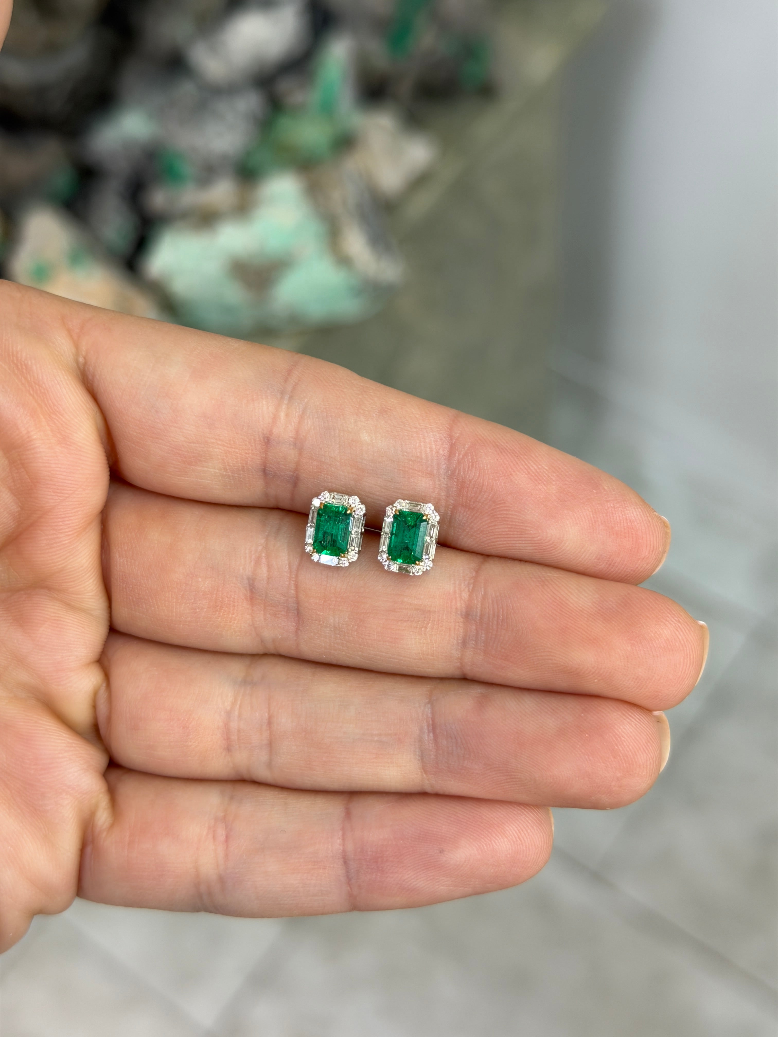 Natural emerald and baguette diamond halo stud earrings in 18K two-tone gold, featuring fine quality gemstones by JR Colombian Emeralds