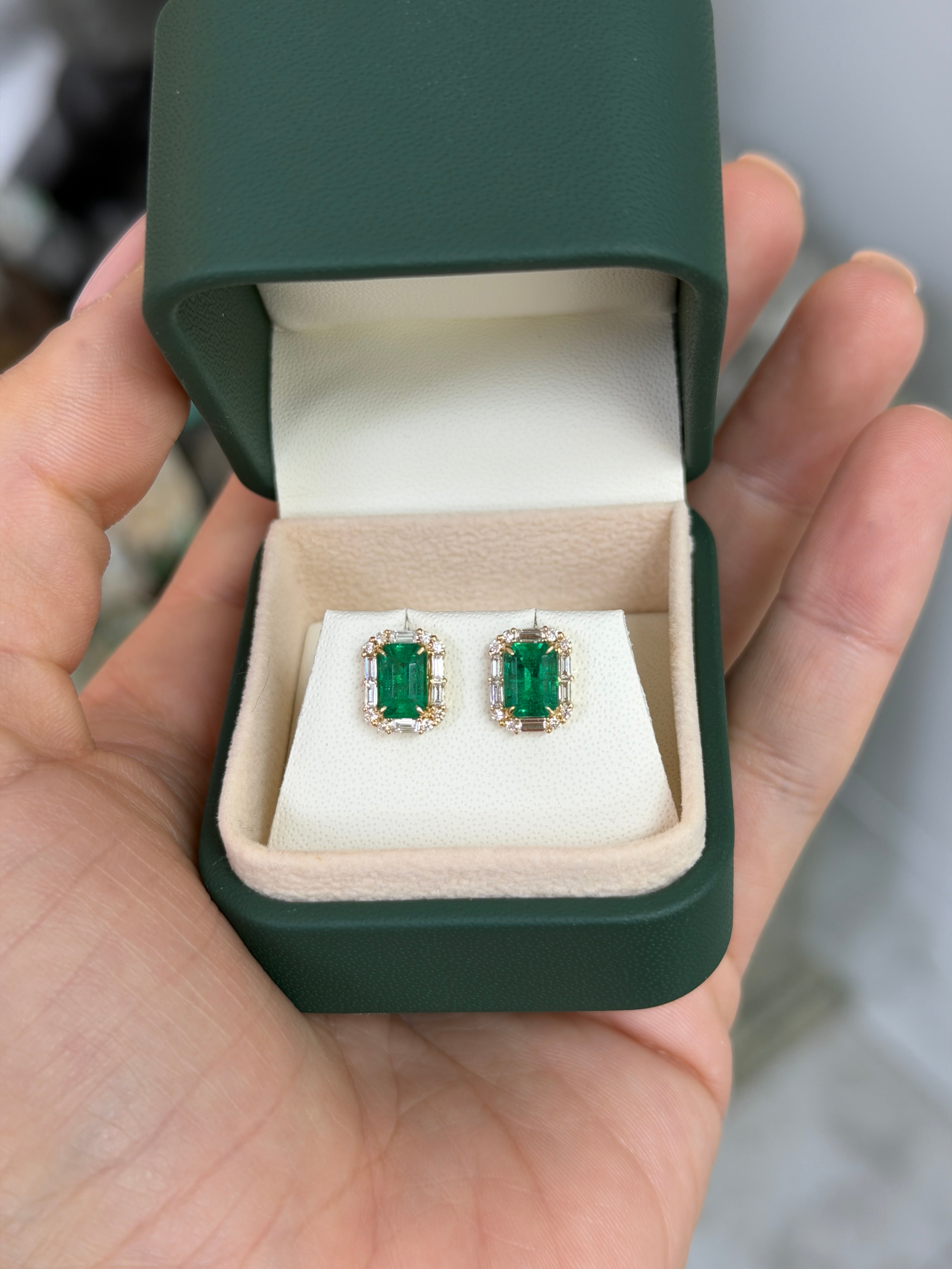 18K gold emerald and diamond halo stud earrings featuring 2.55tcw rich green emeralds and baguette diamonds by JR Colombian Emeralds