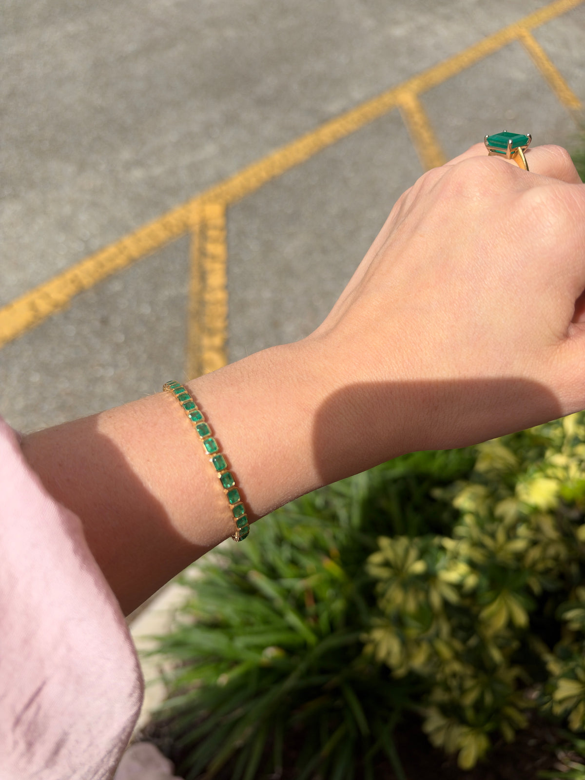 14K gold emerald tennis bracelet with east-west bezel set emeralds totaling 6.69 carats, from JR Colombian Emeralds.