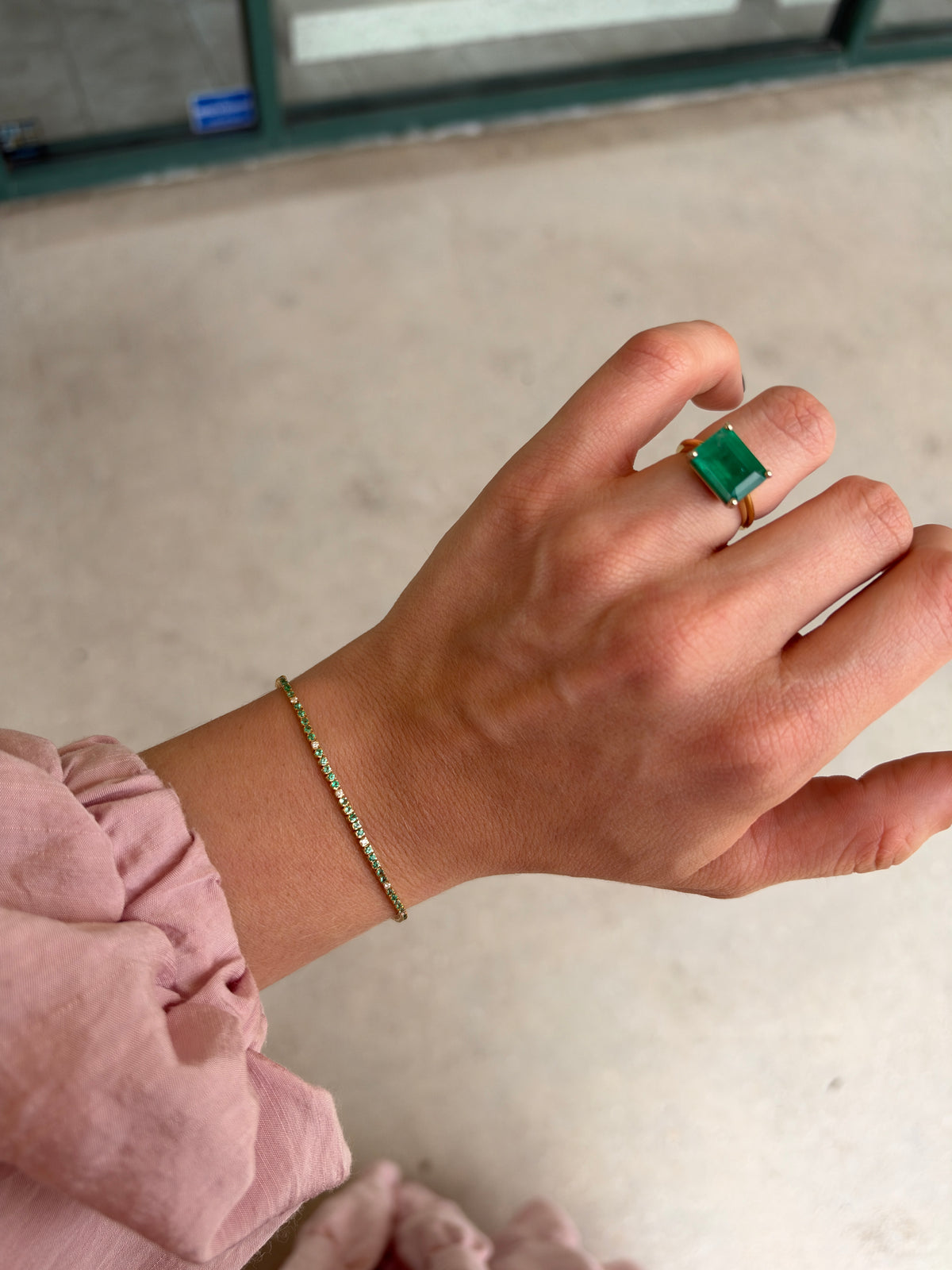 Petite 1.14tcw emerald and diamond tennis bracelet in 14K yellow gold, 7-inch length, featuring sparkling gemstones.