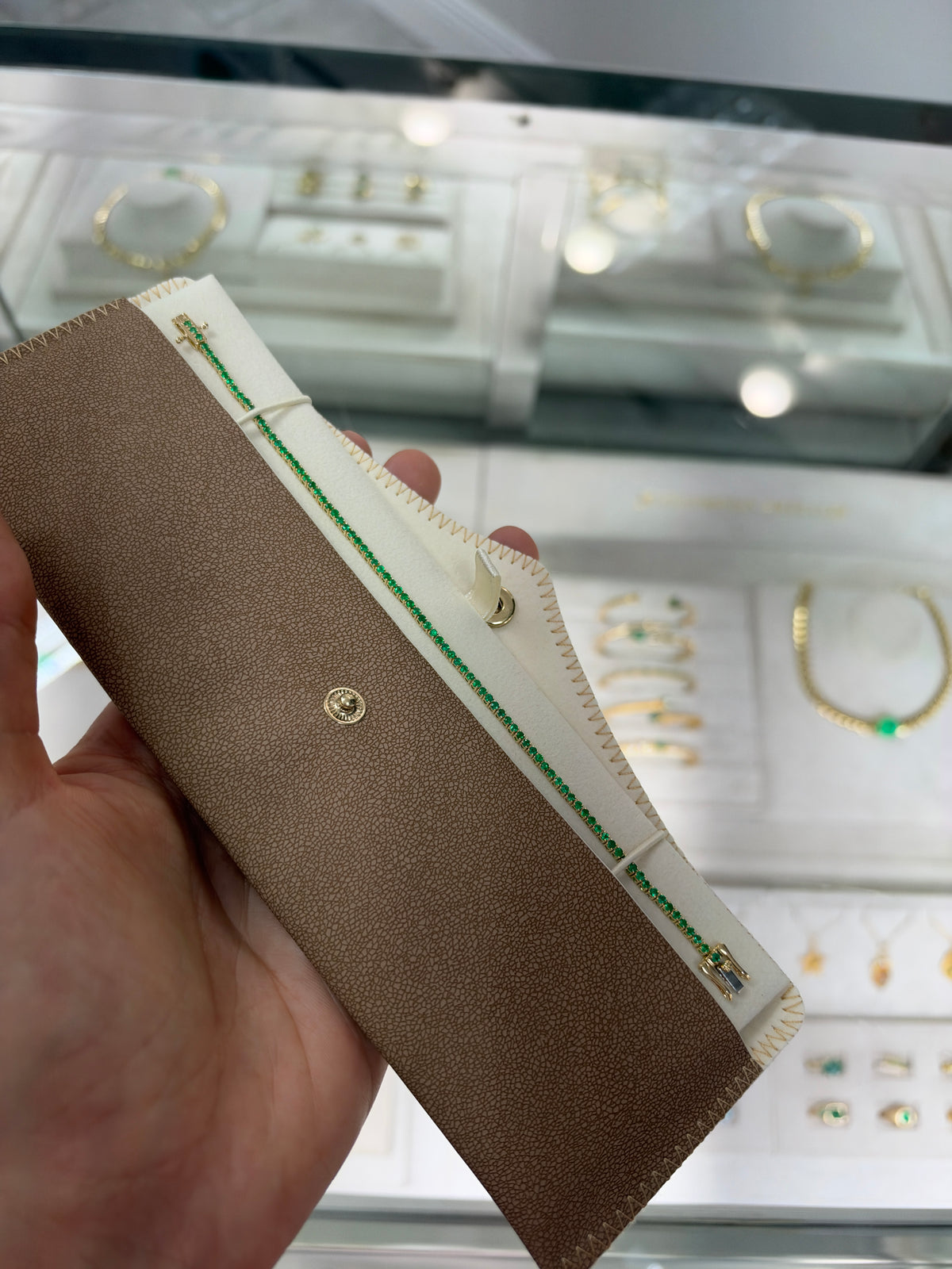 Petite 1.72tcw round emerald tennis bracelet in 14K gold by JR Colombian Emeralds, 7-inch length, detailed close-up shot.