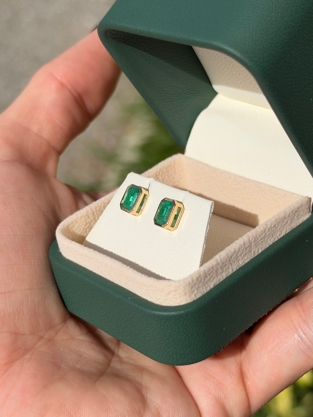 14K natural emerald cut emerald stud earrings with bezel setting by JR Colombian Emeralds, featuring 1.20tcw of vibrant green gemstones