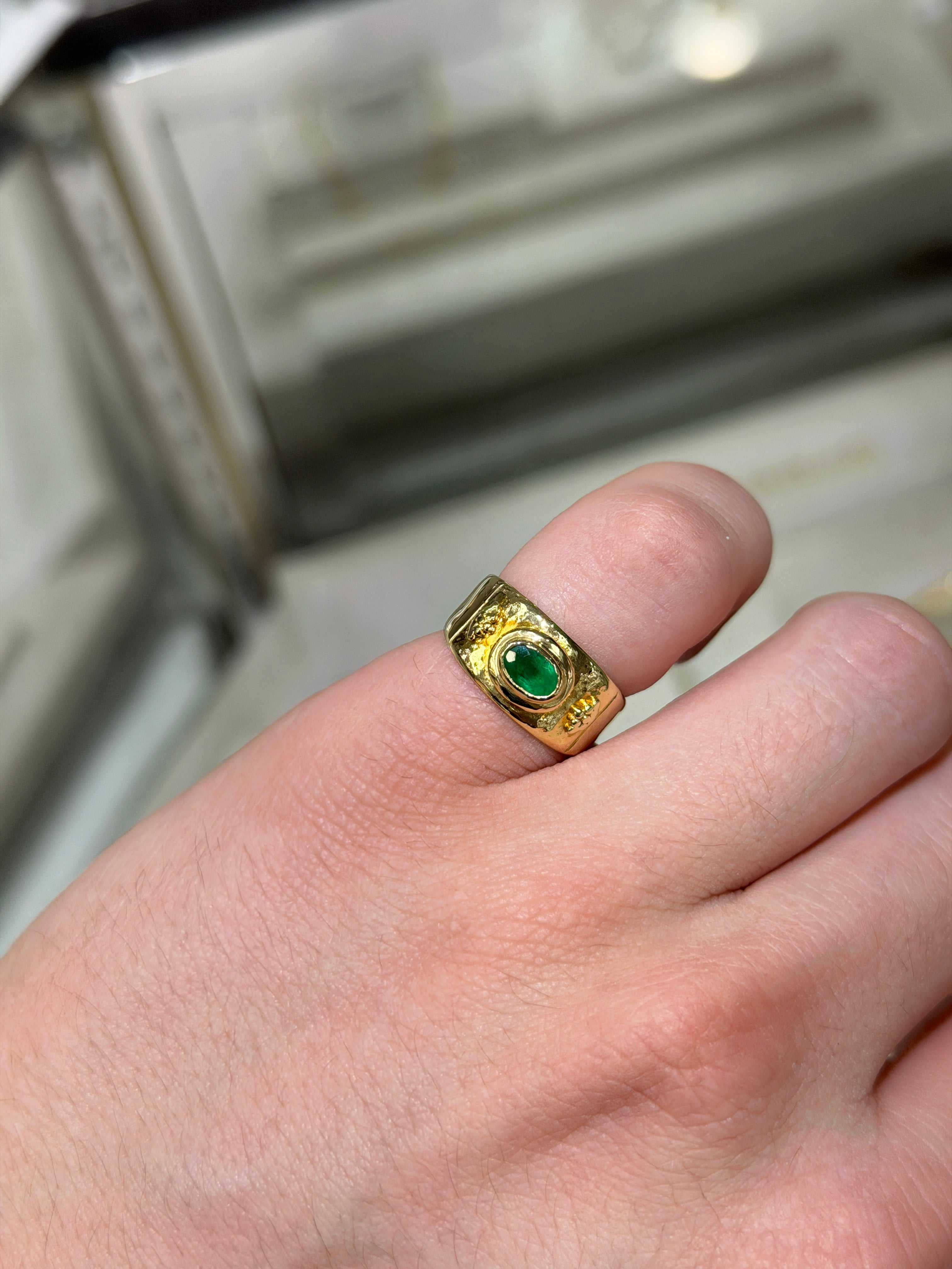 0.65tcw 18K yellow gold vintage oval emerald bezel pinky ring on hand