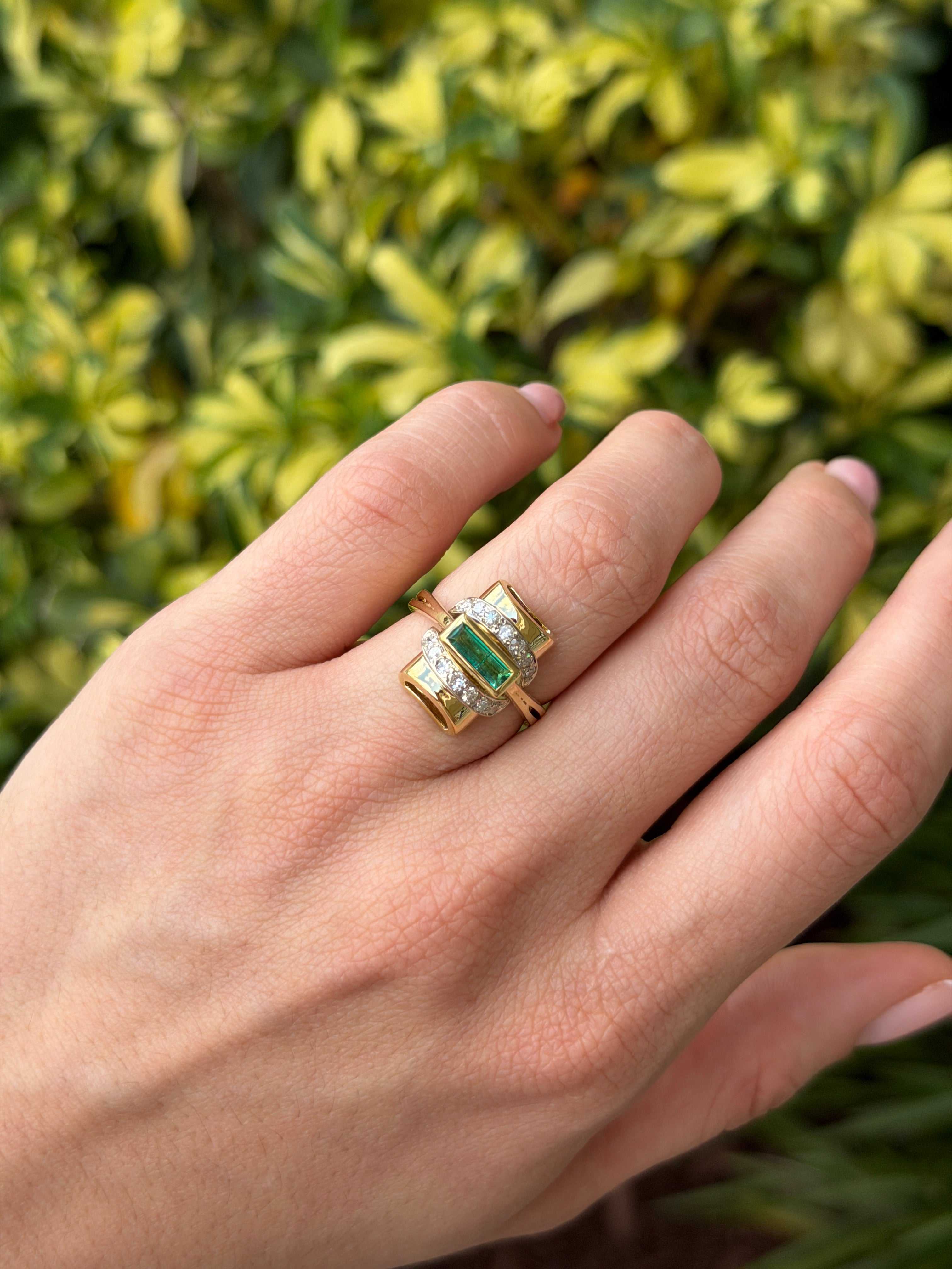 1.66tcw 18K vintage two toned emerald baguette and diamond accent statement ring on hand