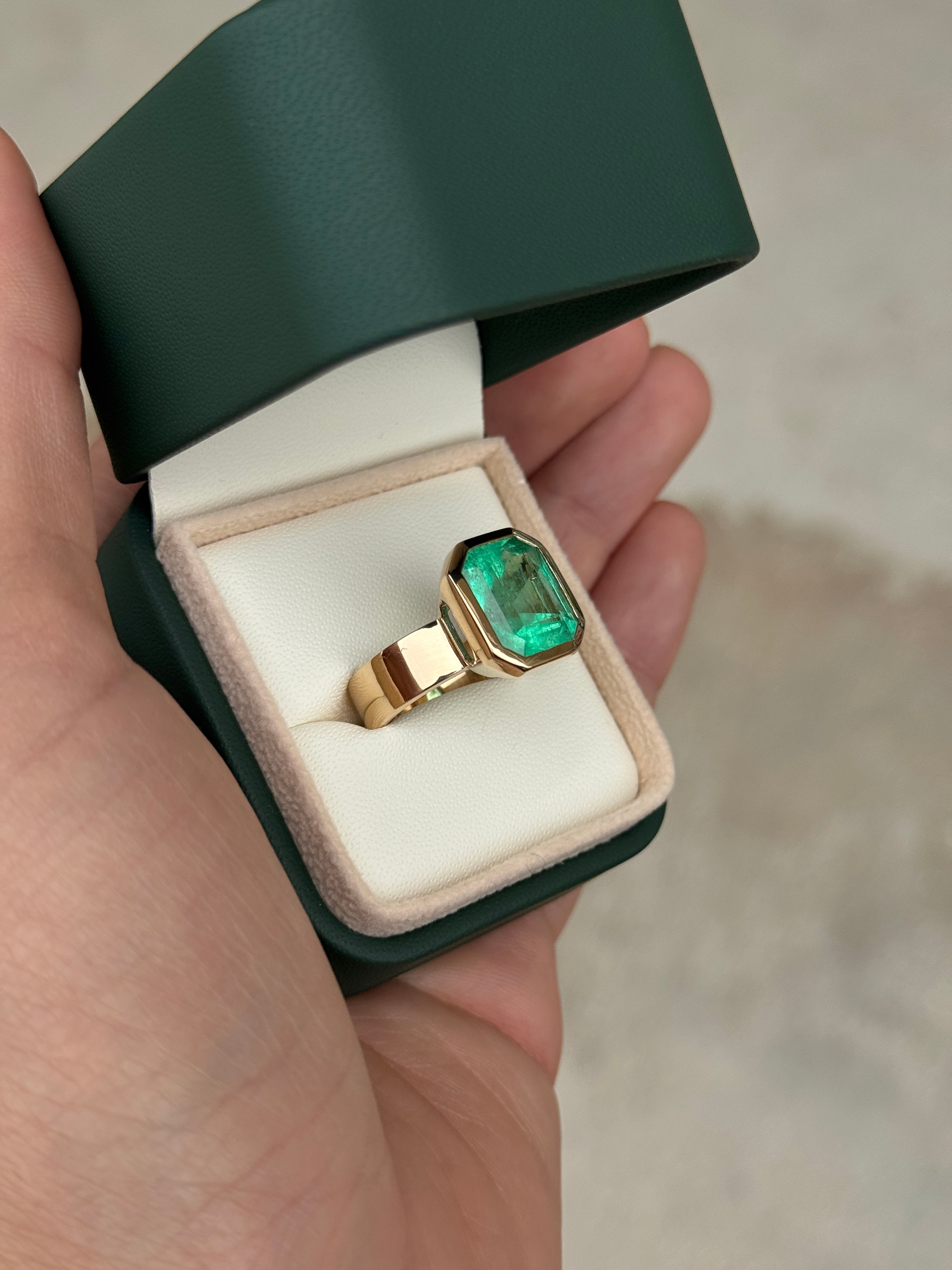 8.15 Carat Ultra Bright Colombian Emerald Solitaire Ring Emerald Cut Bezel Set 18K Gold 6.3mm Wide