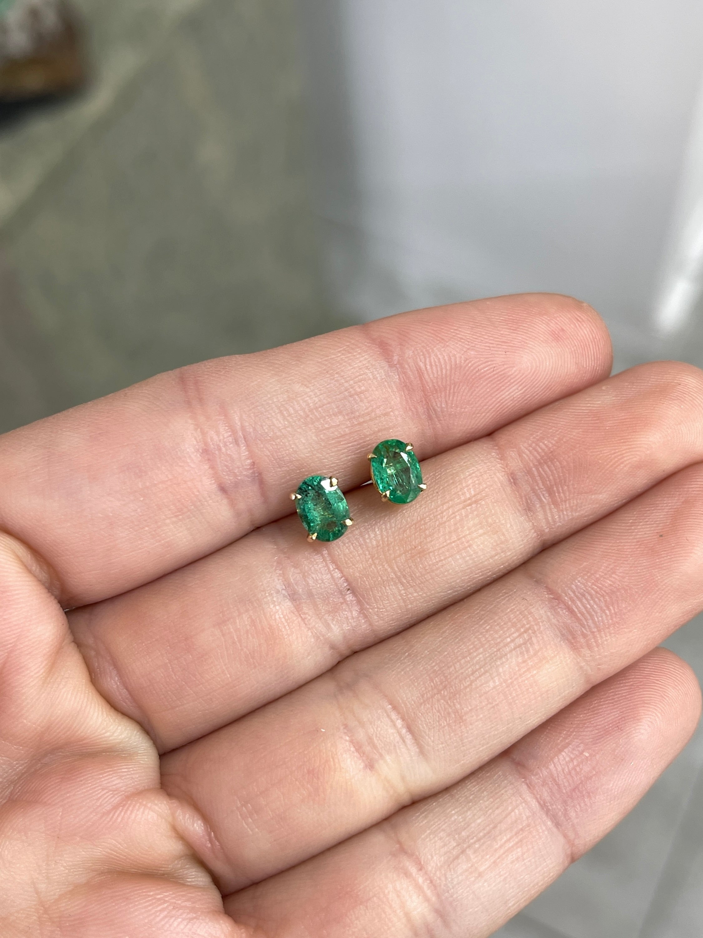 1.60tcw 14K Rich Green Oval Cut Four Prong Emerald Studs Earrings