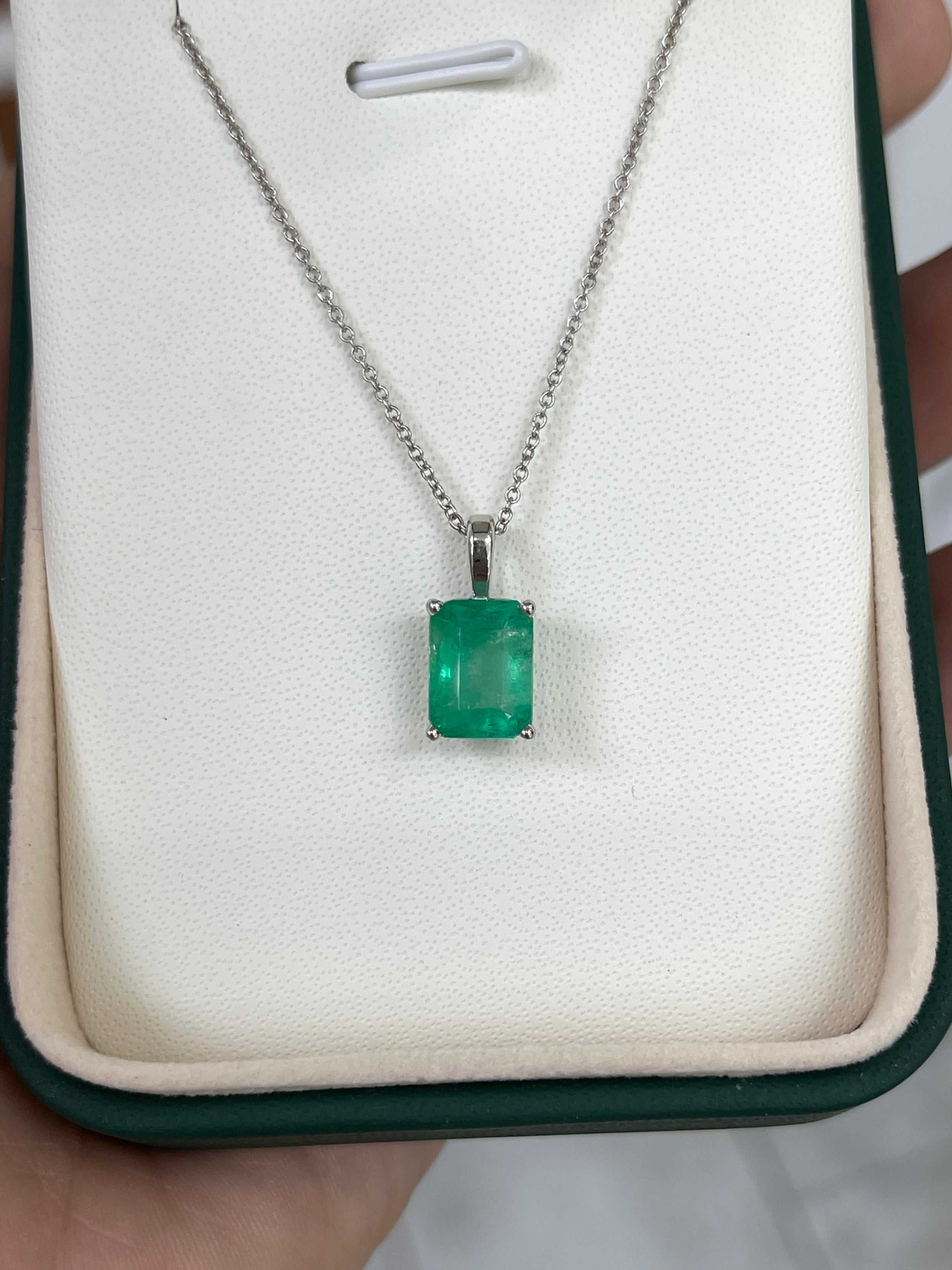 2.39 carat Colombian emerald solitaire pendant in 14K white gold necklace with emerald cut stone