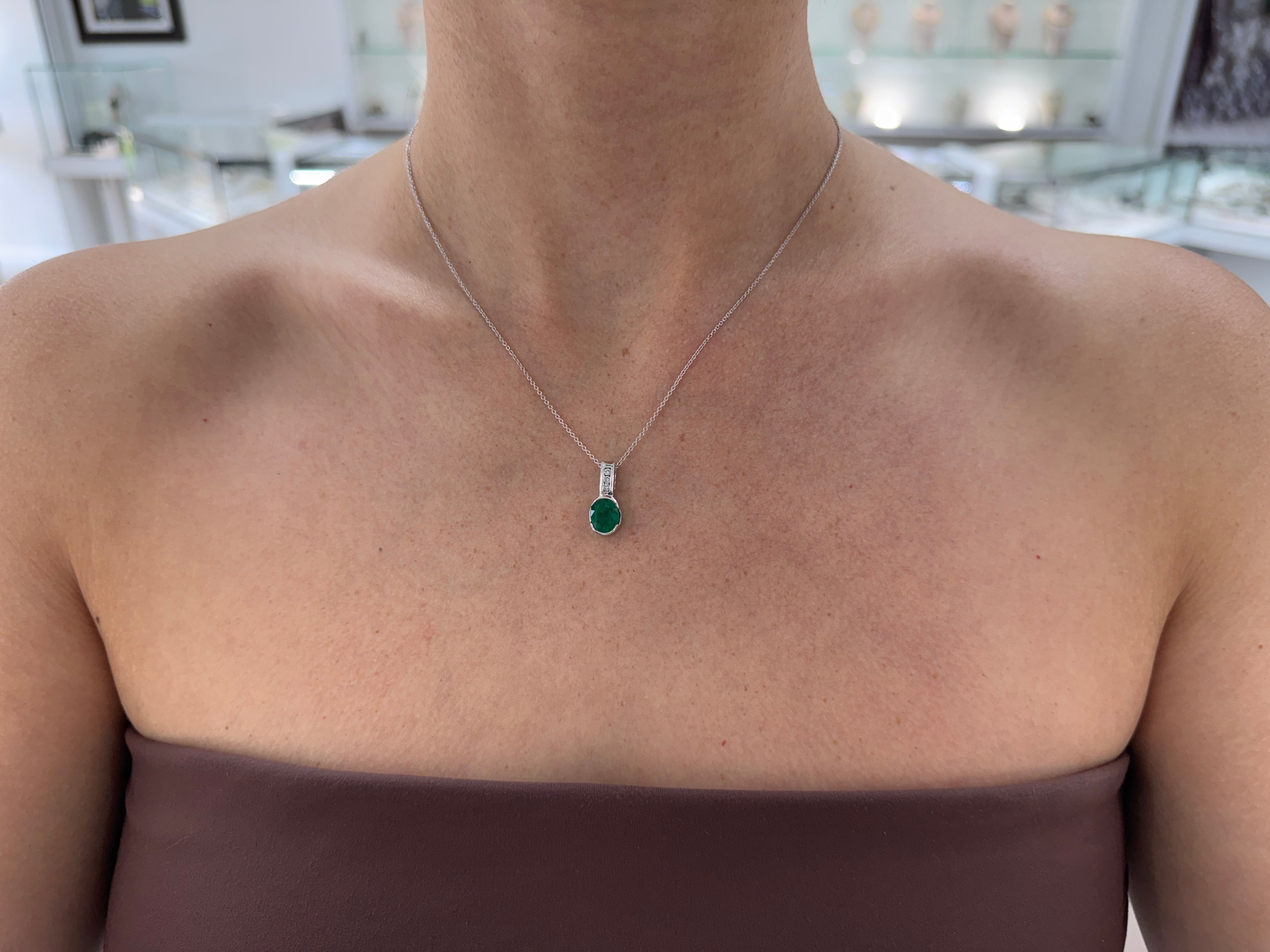 2.25tcw 14K Rich Oval Cut Emerald Half Bezel Set & Diamond Bale Accents