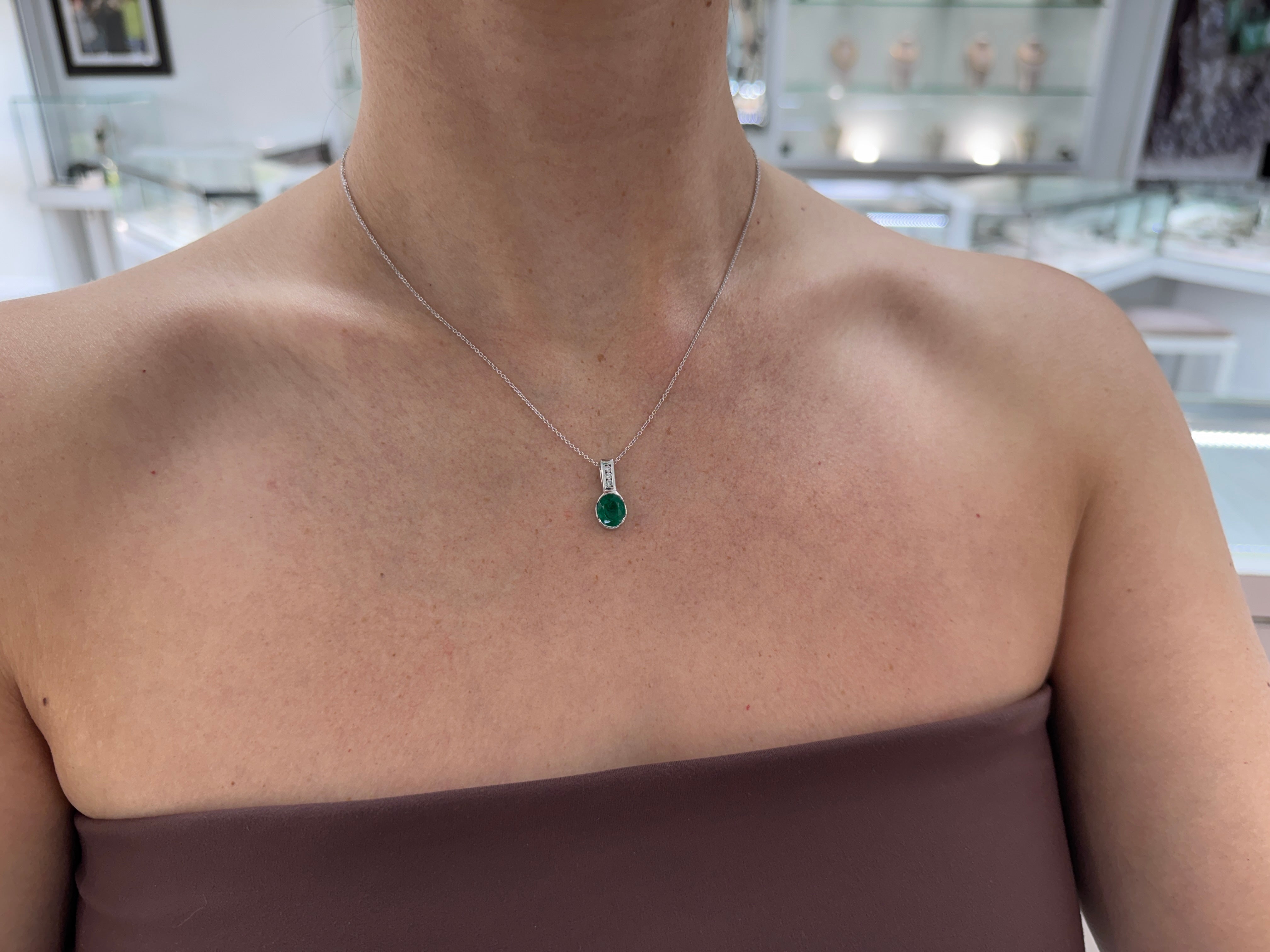 2.25tcw 14K Rich Oval Cut Emerald Half Bezel Set & Diamond Bale Accents
