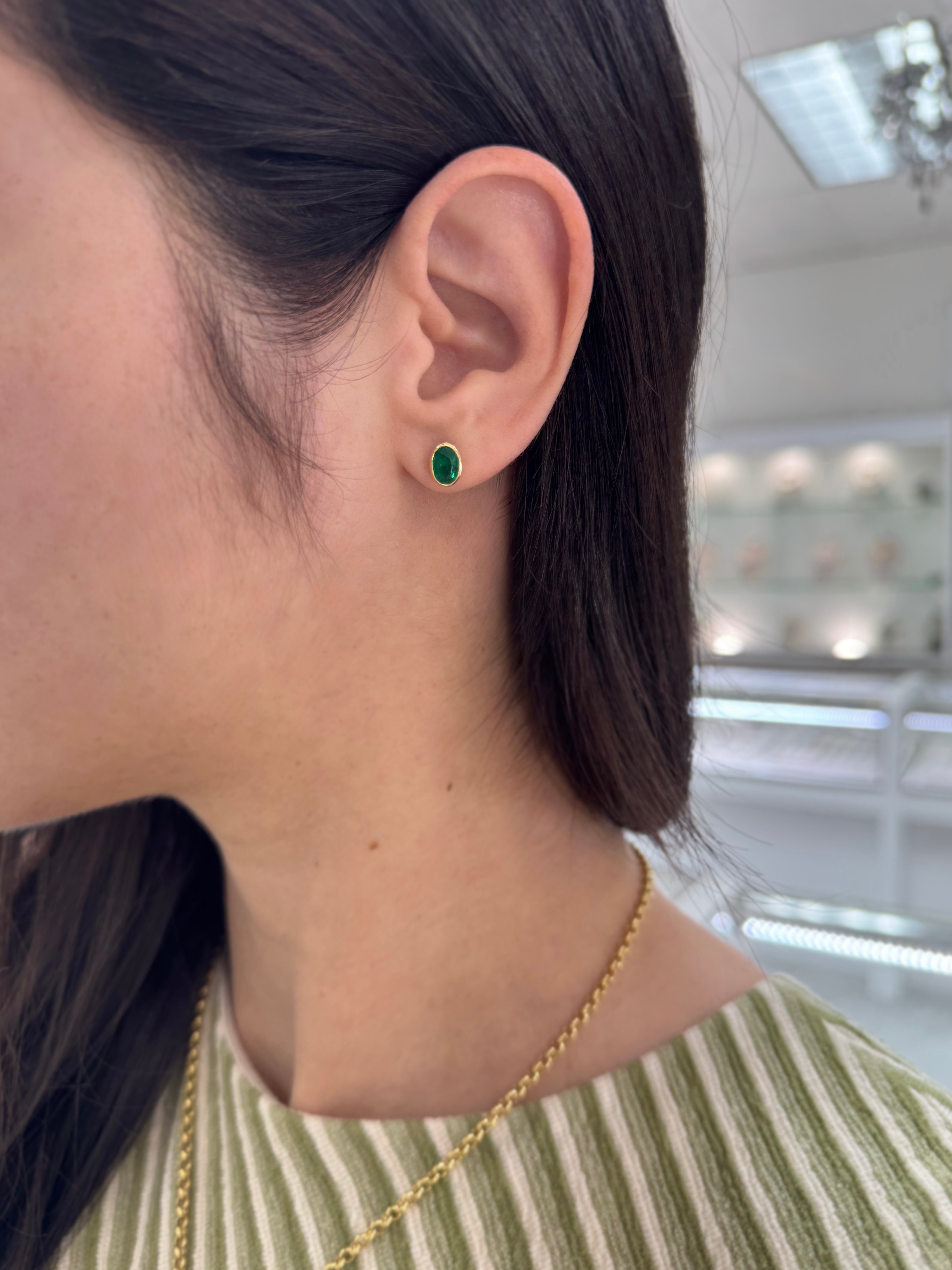 1.45tcw Vivid Green Oval Bezel Set Emerald Studs 18K