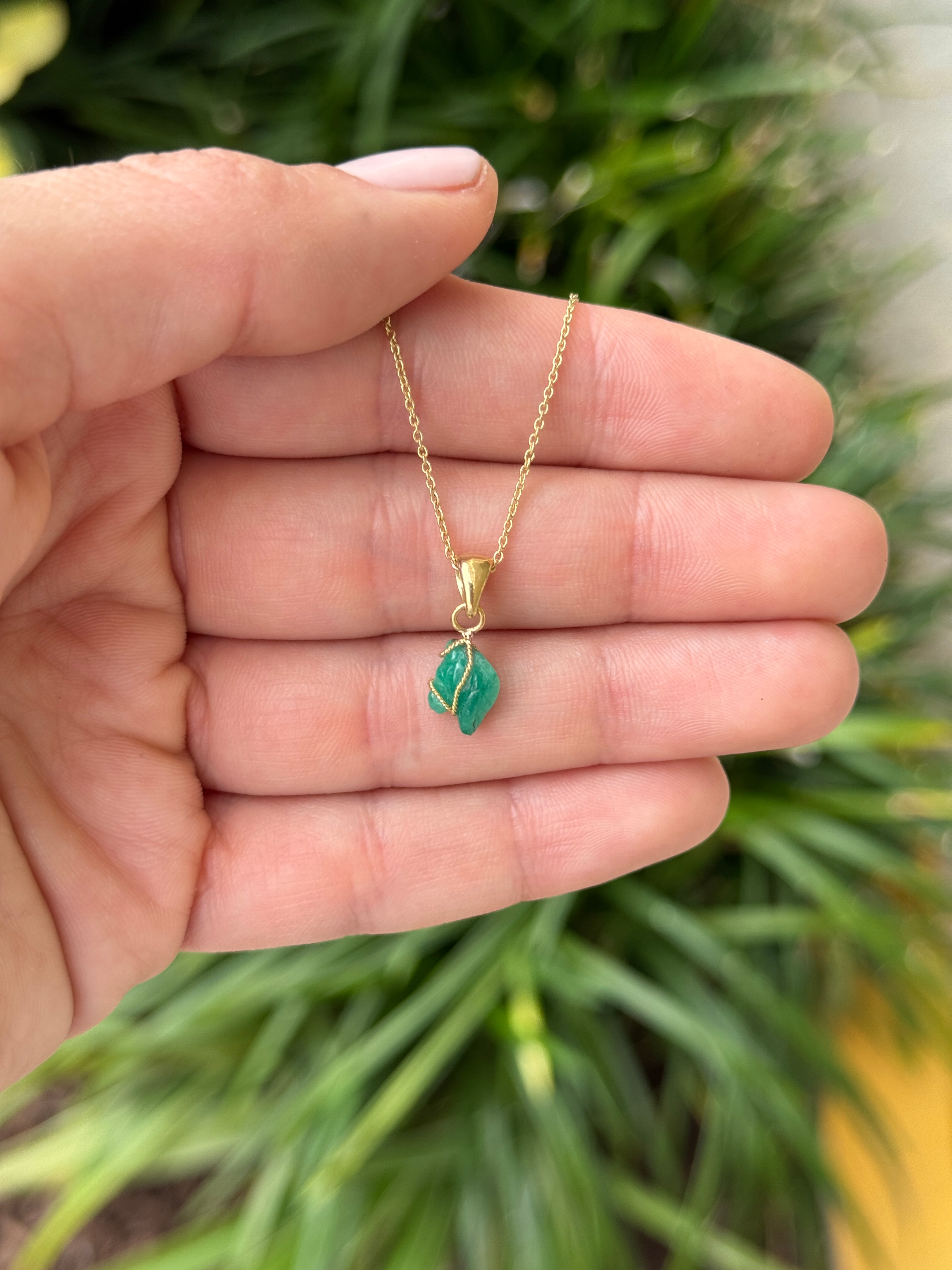 18K necklace featuring a 1.40 carat Chinese New Year horse-shaped Colombian emerald pendant by JR Colombian Emeralds.