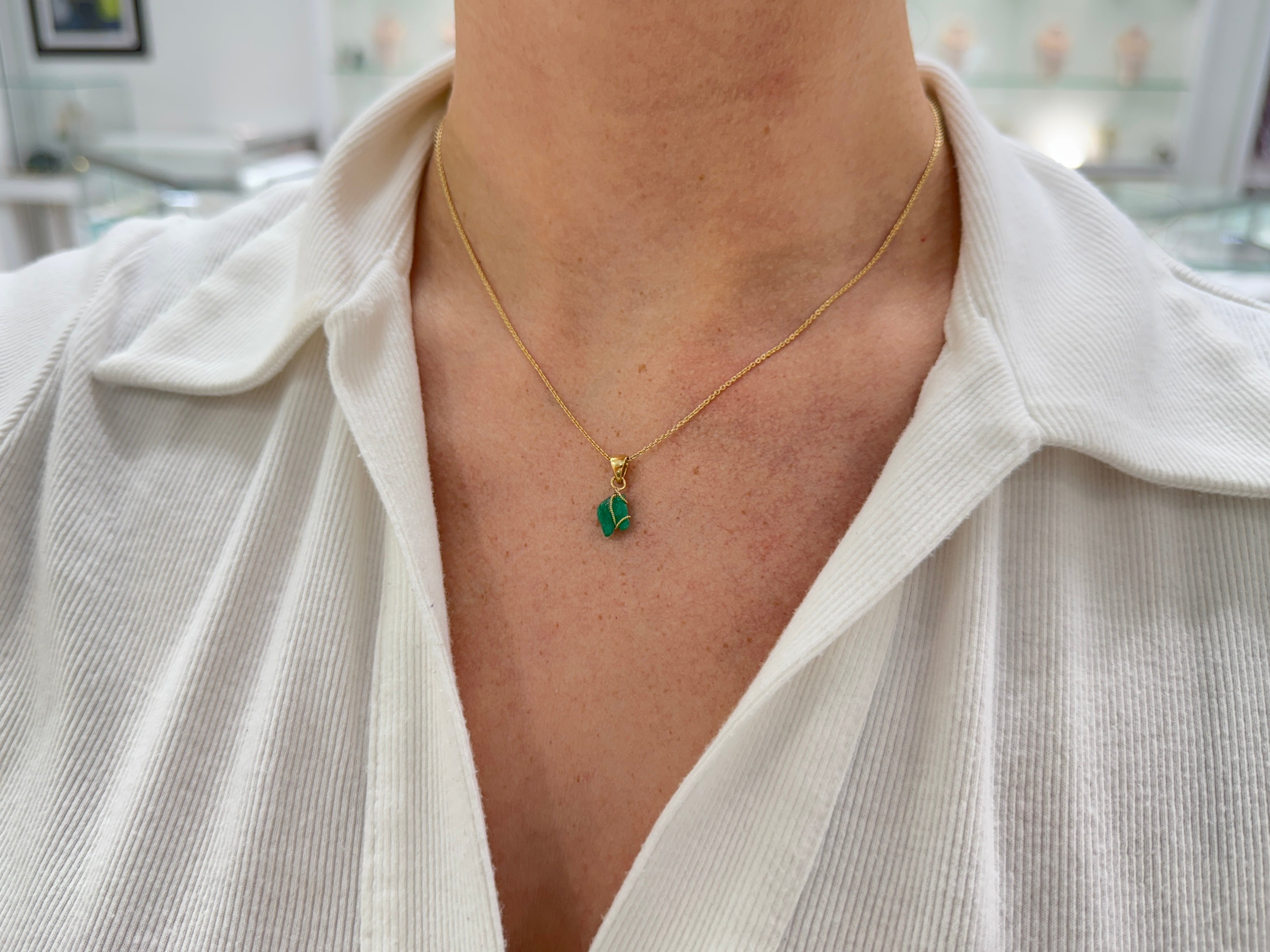 18K necklace featuring a 1.40 carat Chinese New Year horse-shaped Colombian emerald pendant from JR Colombian Emeralds.