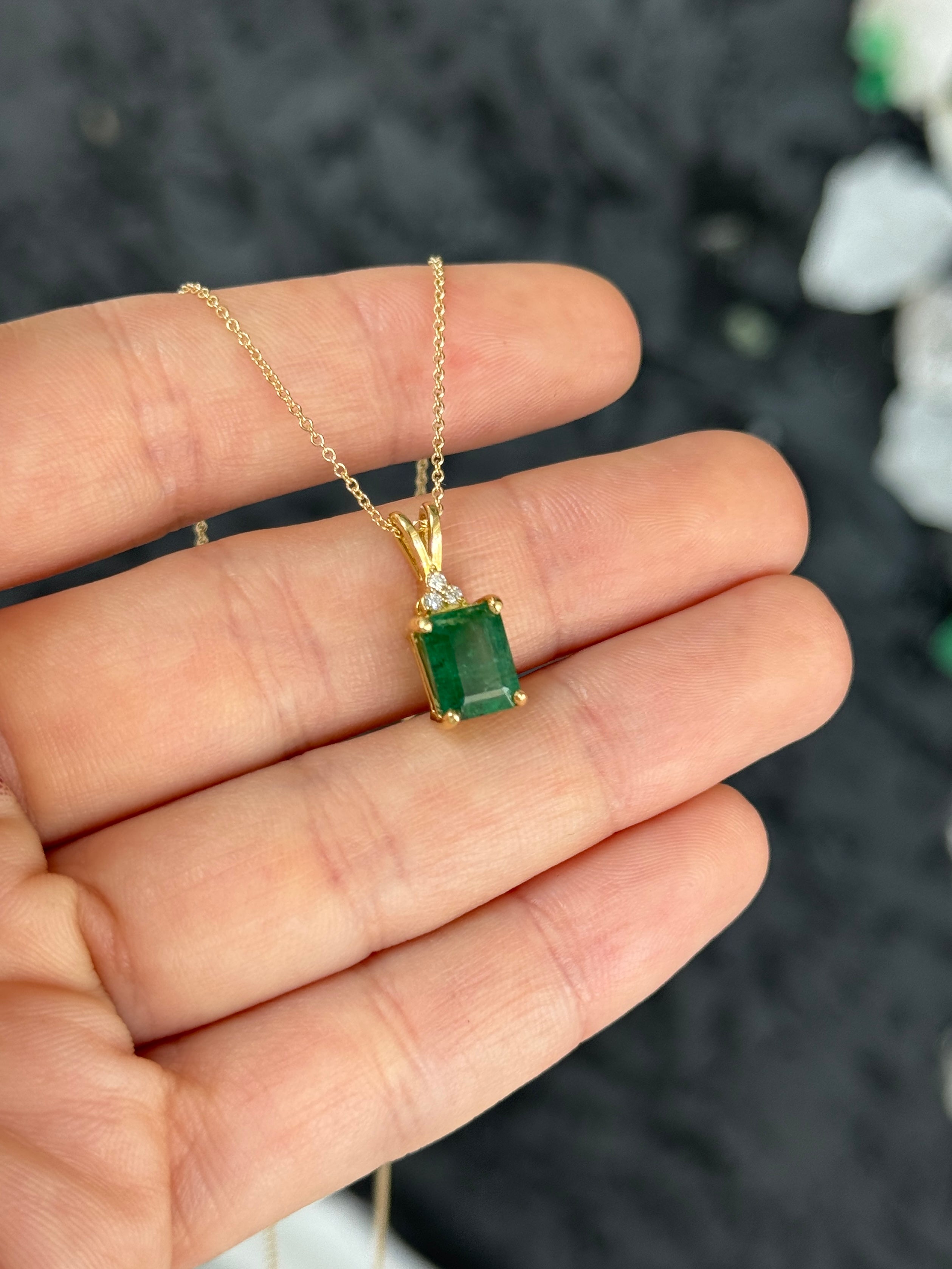 Emerald cut emerald pendant with trefoil diamond accents in 14K gold, featuring a 2.75 carat total weight, by JR Colombian Emeralds.