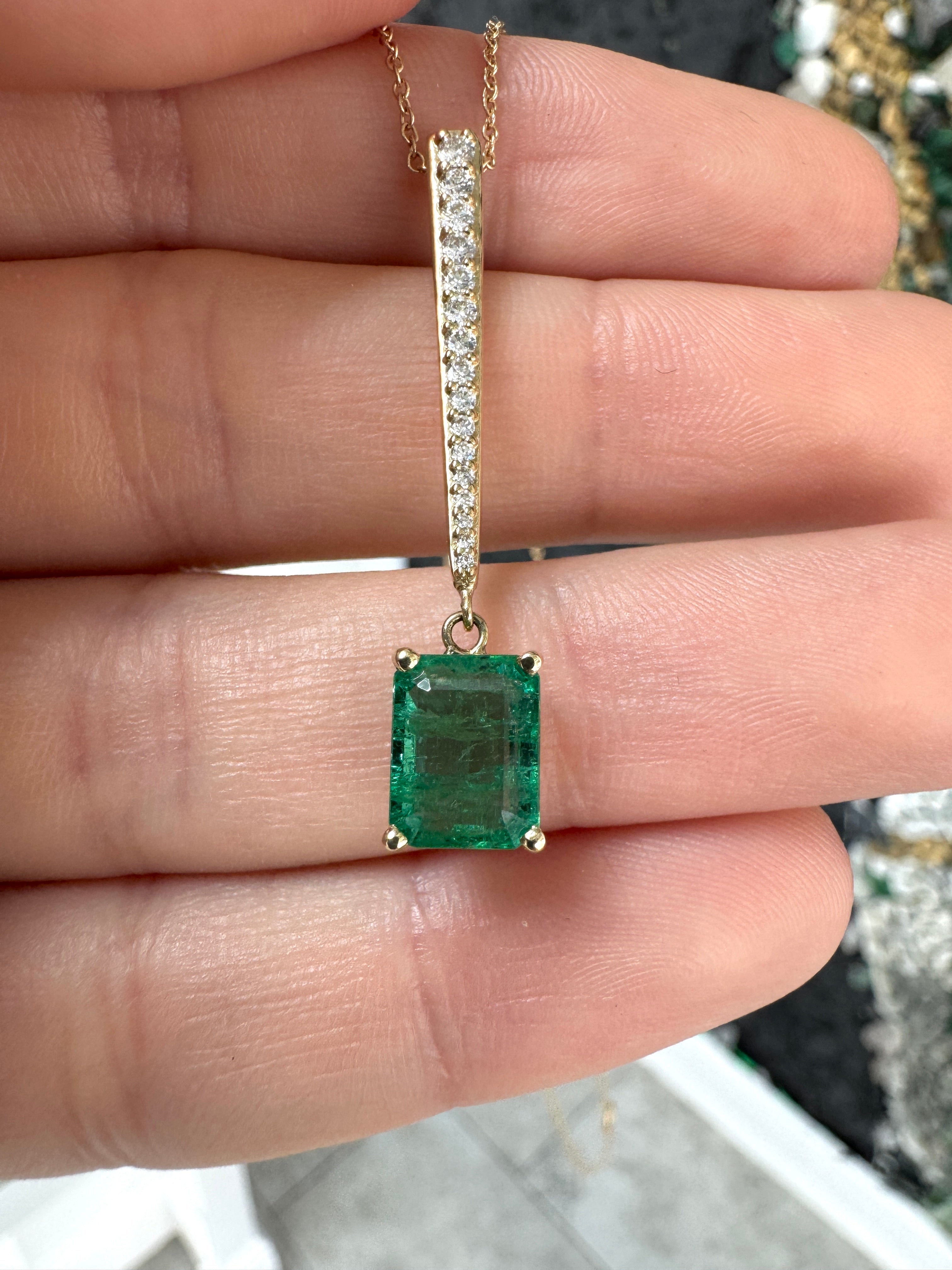 14K gold emerald and diamond V drop pendant necklace featuring a 2.68 carat natural emerald cut emerald with diamond accents by JR Colombian Emeralds