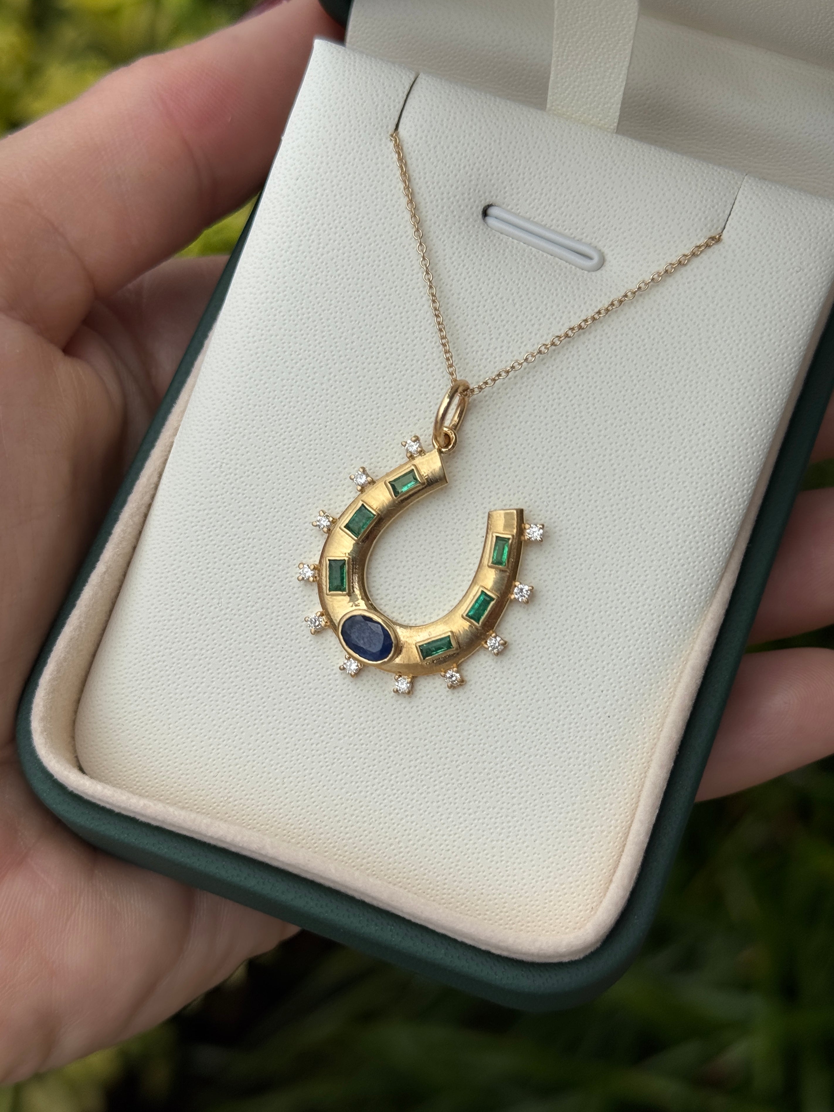 14K gold horseshoe charm pendant with 1.26tcw natural sapphire, emerald, and diamond accents, crafted by JR Colombian Emeralds.