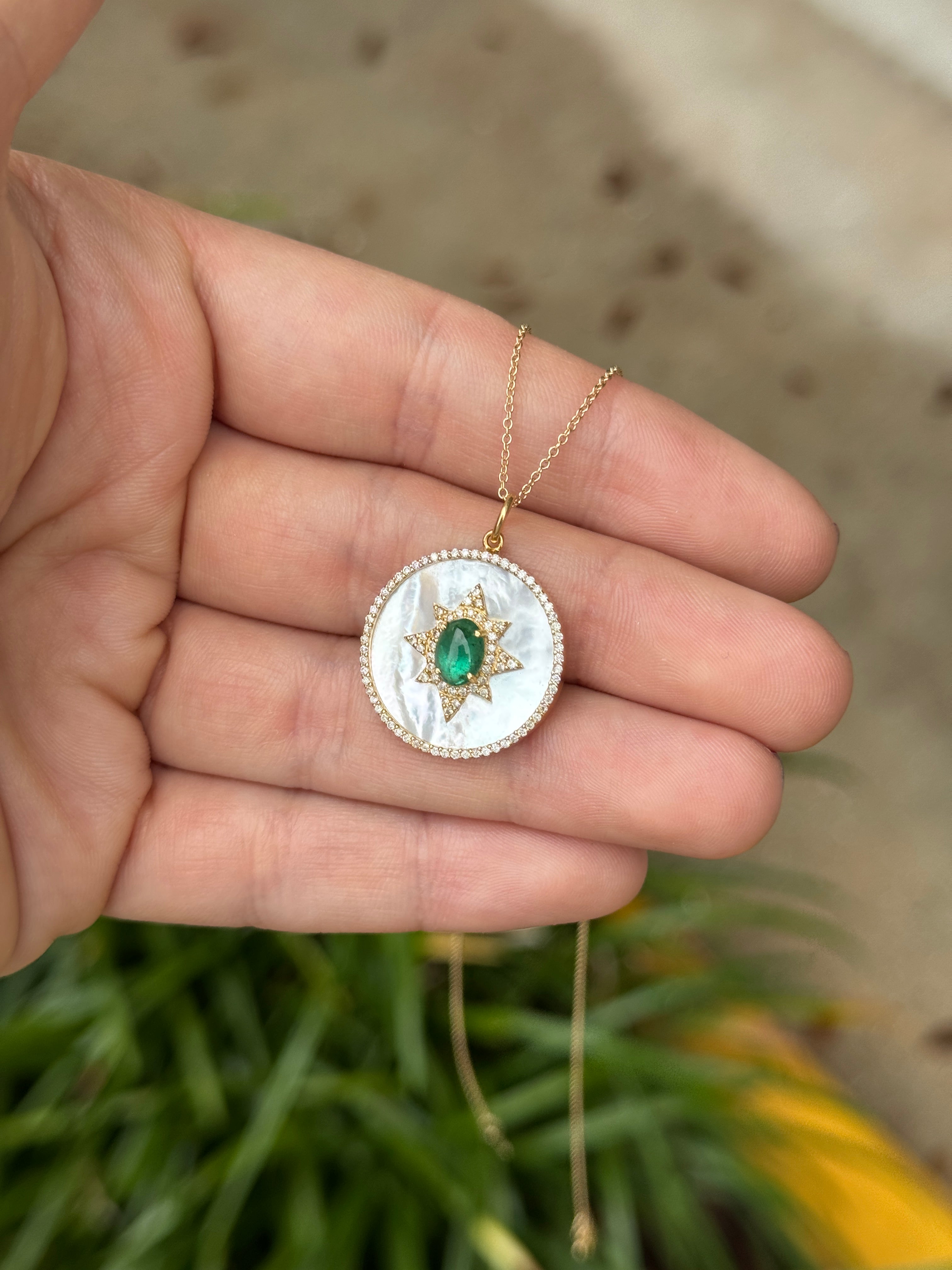 14K gold starburst medallion featuring emerald cabochon, mother of pearl, and diamond halo, by JR Colombian Emeralds