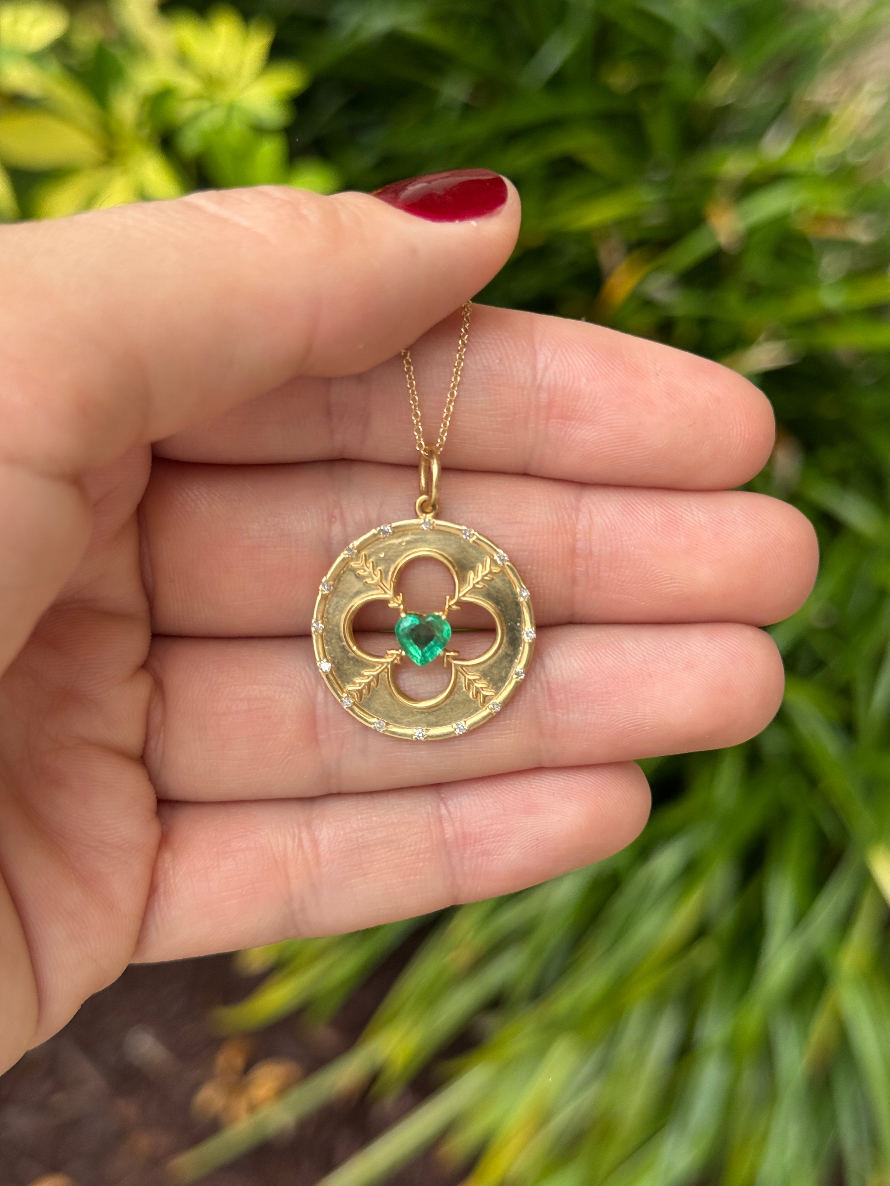 14K gold heart-shaped emerald and diamond motif medallion pendant with 0.86tcw from JR Colombian Emeralds.