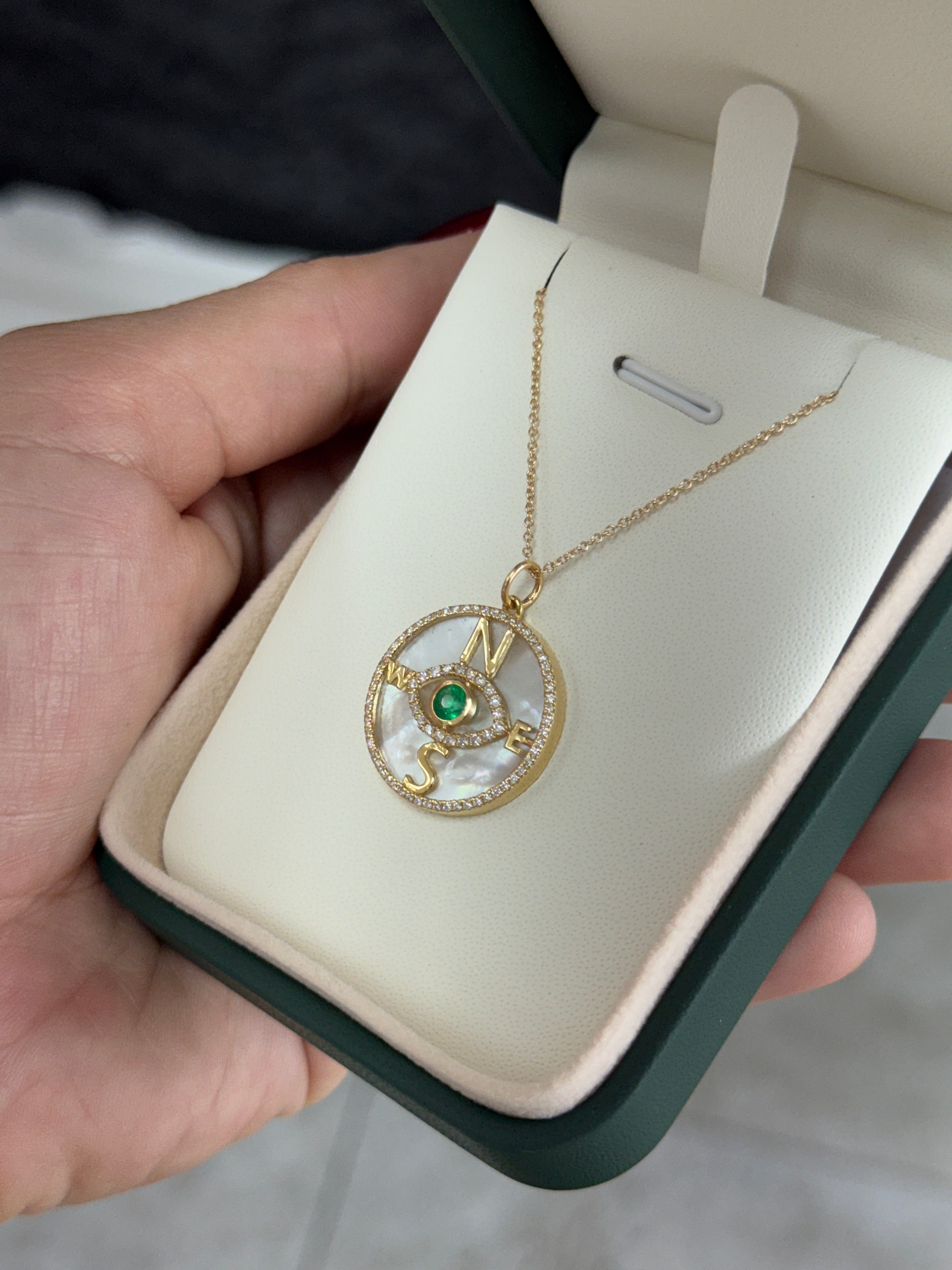 14K gold compass evil eye pendant necklace with round emeralds, diamonds, and mother-of-pearl by JR Colombian Emeralds