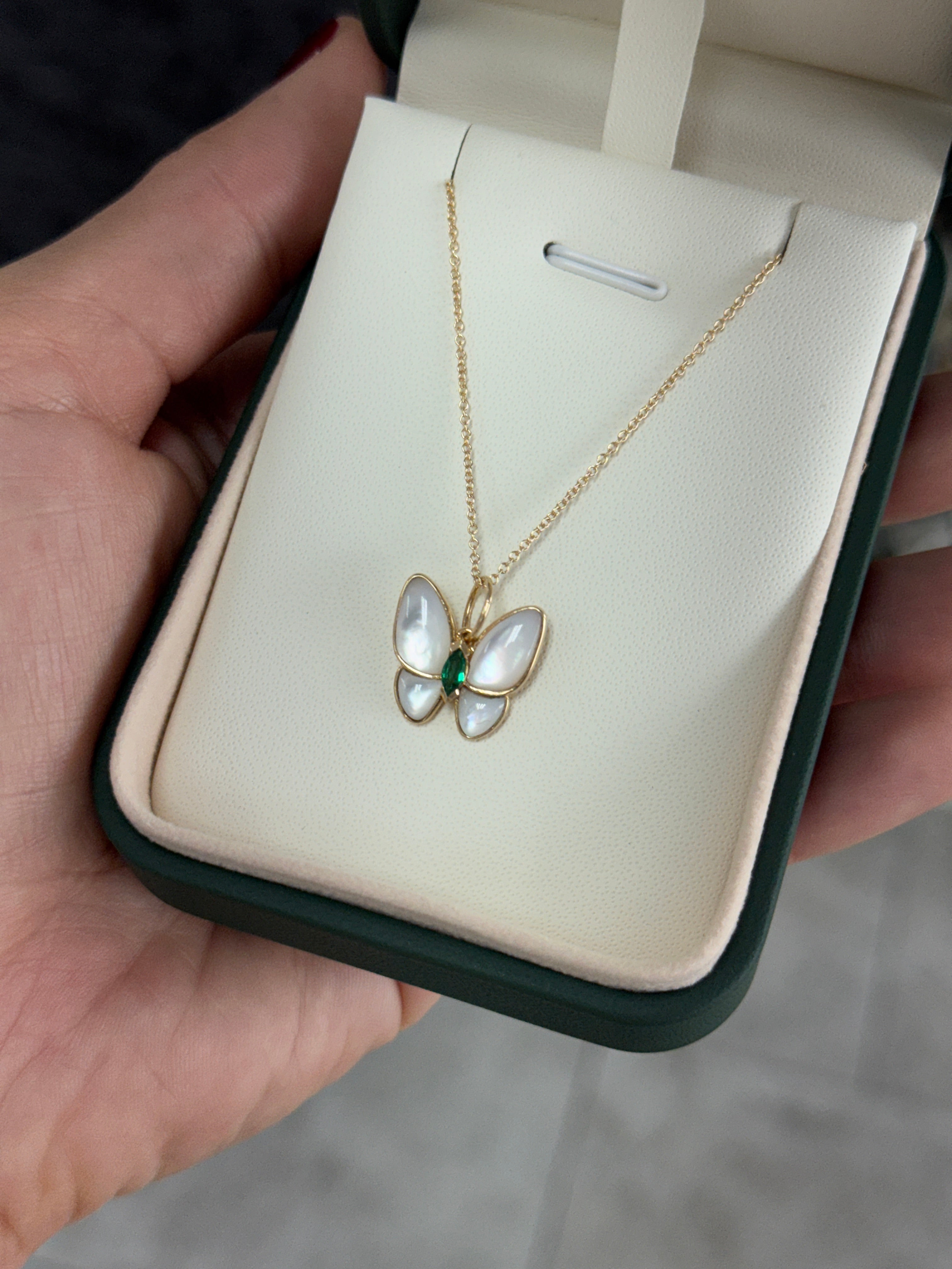 14K gold butterfly pendant with 2.90tcw marquise emeralds and mother of pearl from JR Colombian Emeralds jewelry collection.