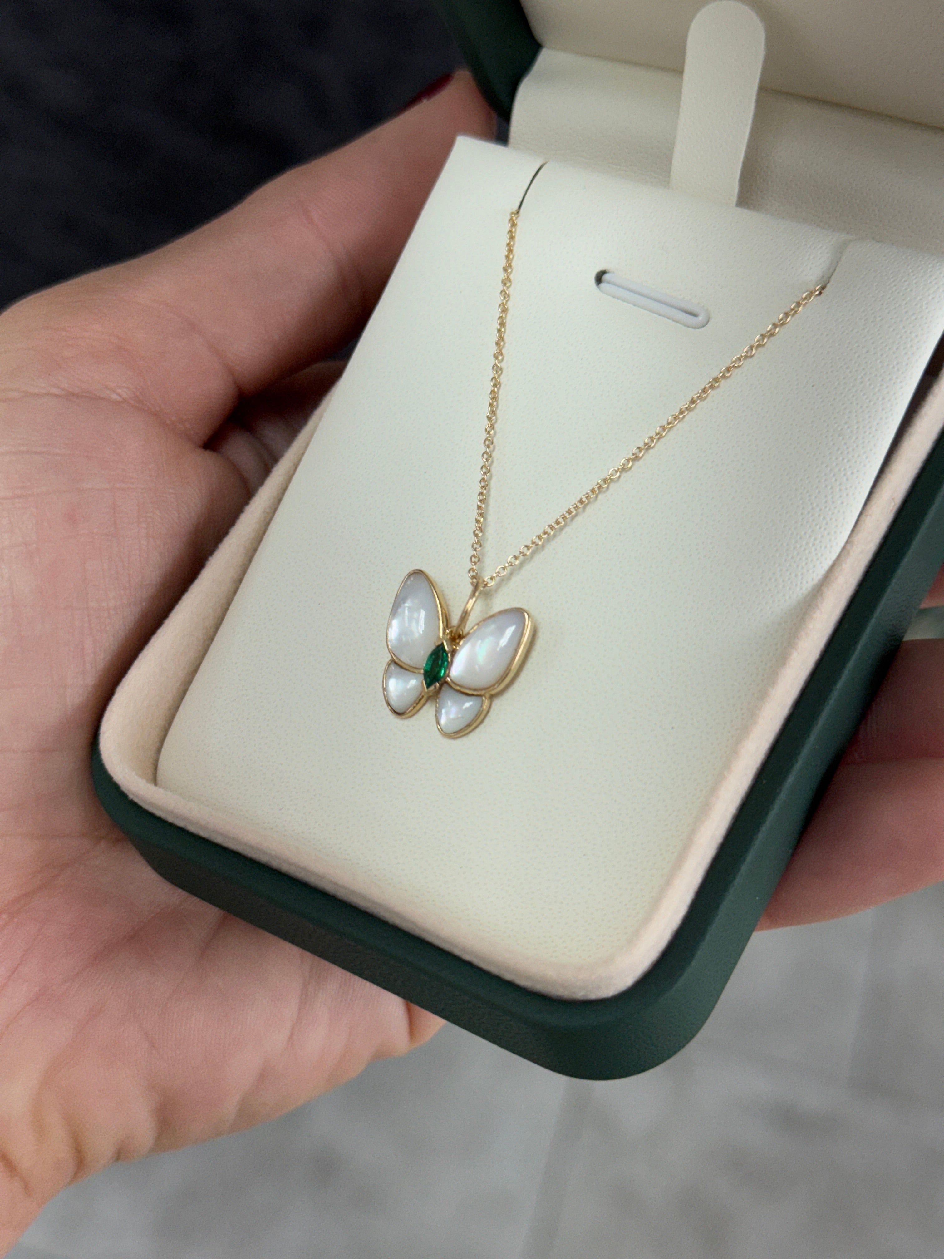 14K gold butterfly pendant with 2.90tcw marquise emeralds and mother of pearl accents, by JR Colombian Emeralds.