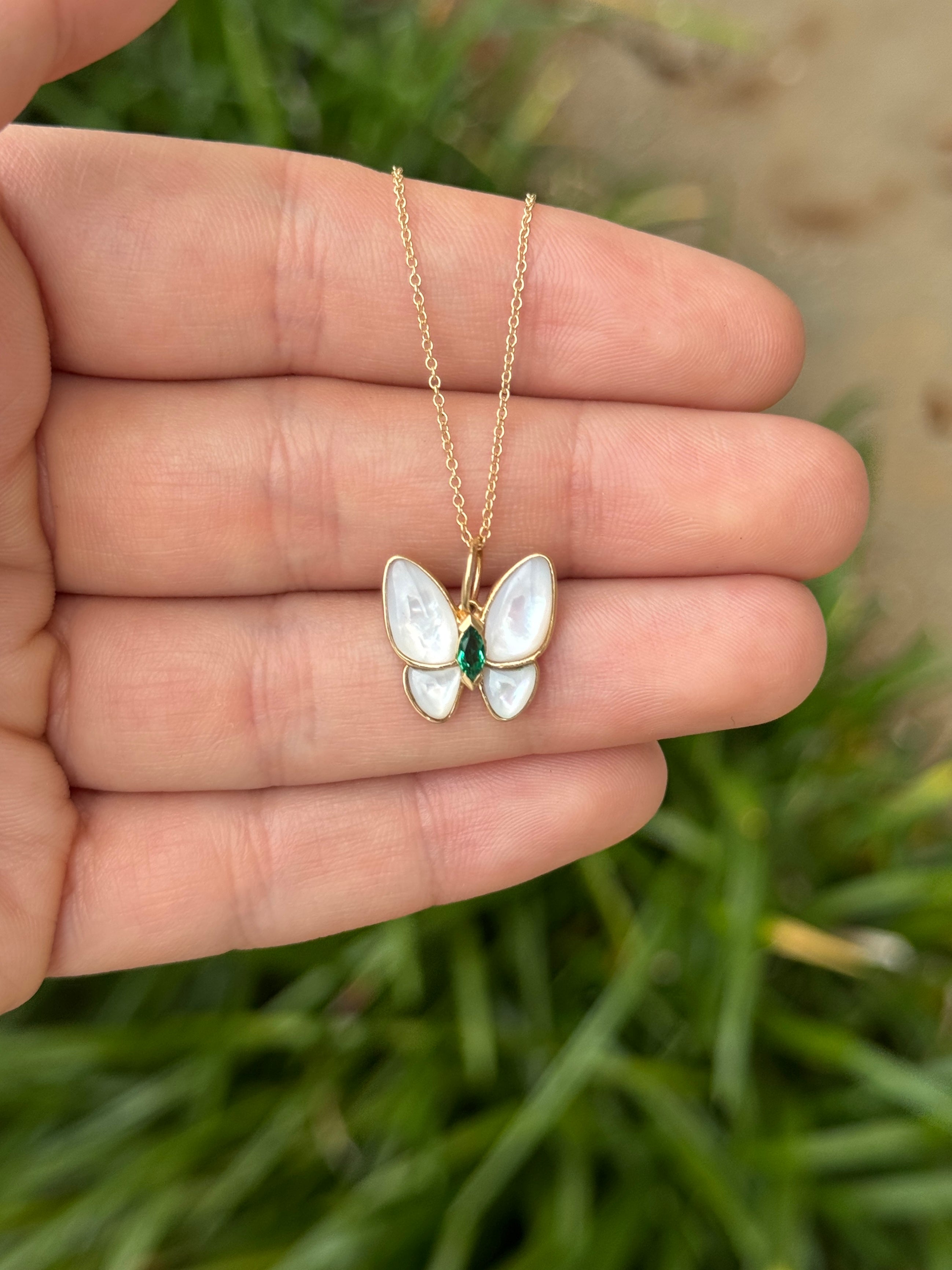 14K gold butterfly pendant with 2.90tcw marquise emeralds and mother of pearl accents, from JR Colombian Emeralds.