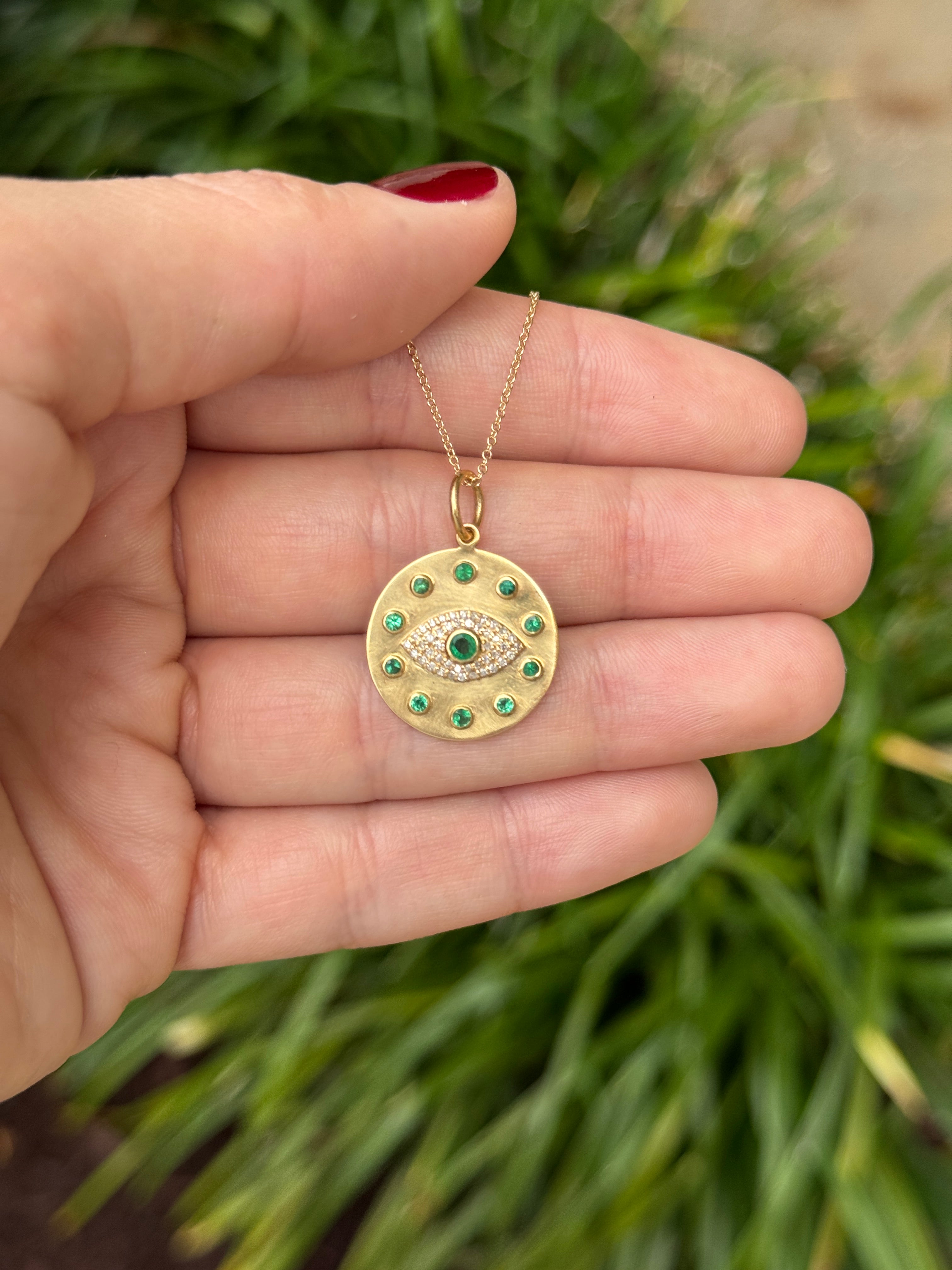 14K gold evil eye pendant with emerald and diamond accents, featuring a protective charm design by JR Colombian Emeralds