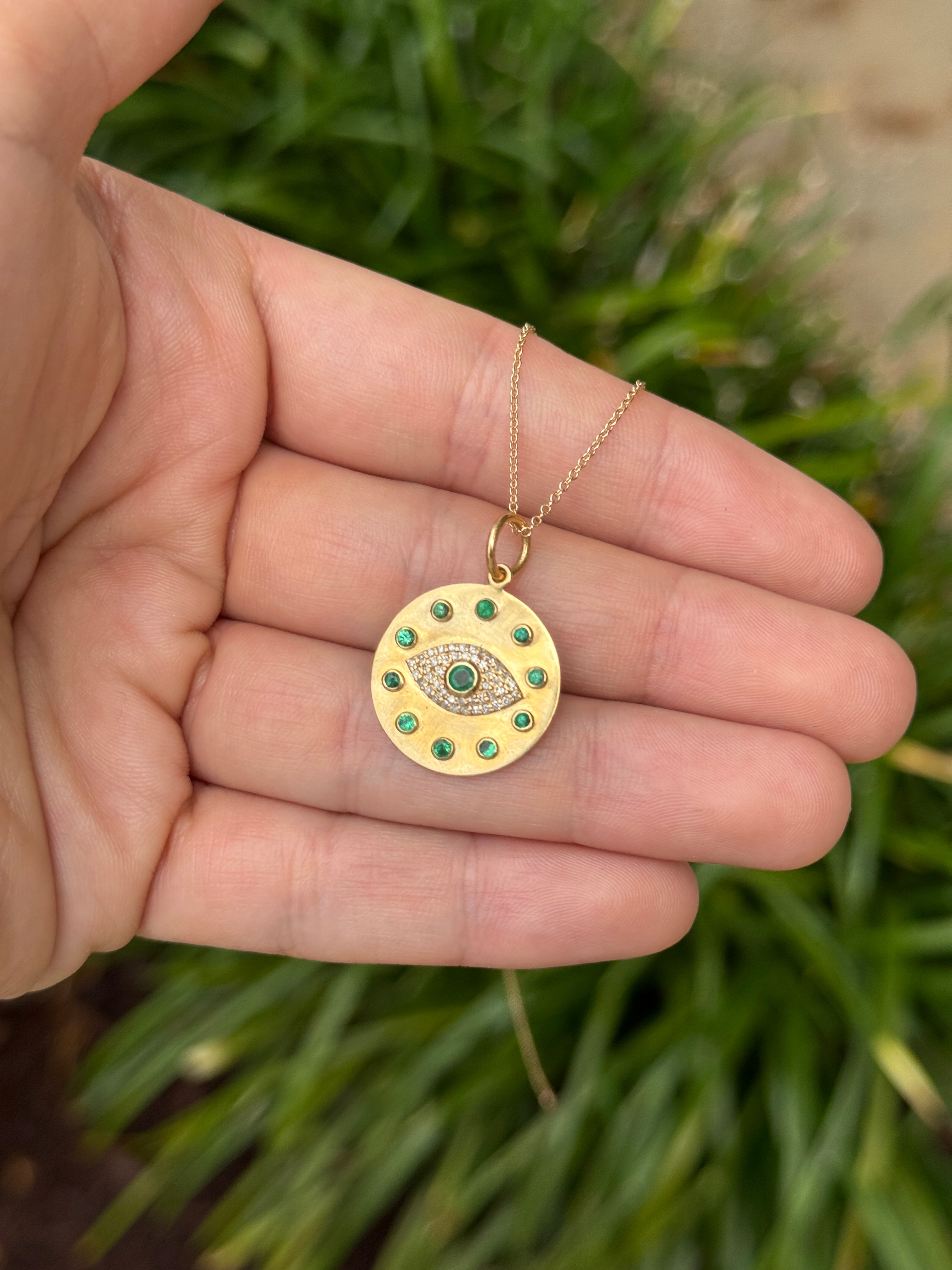 14K gold evil eye pendant with natural emerald and diamond accents, featuring a protective charm design by JR Colombian Emeralds