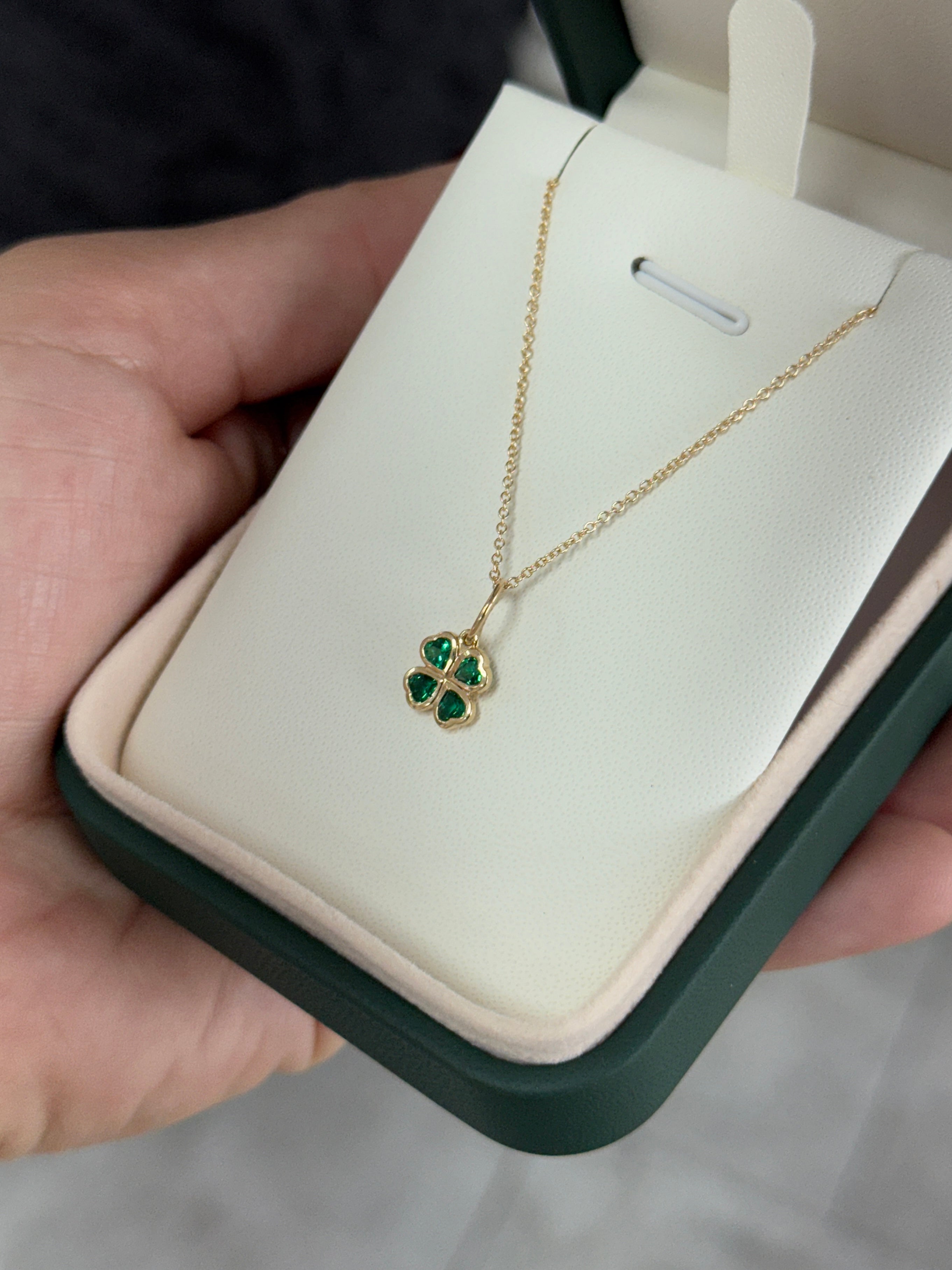 14K gold emerald clover charm pendant with heart-cut emeralds, 0.44 carats, from JR Colombian Emeralds.