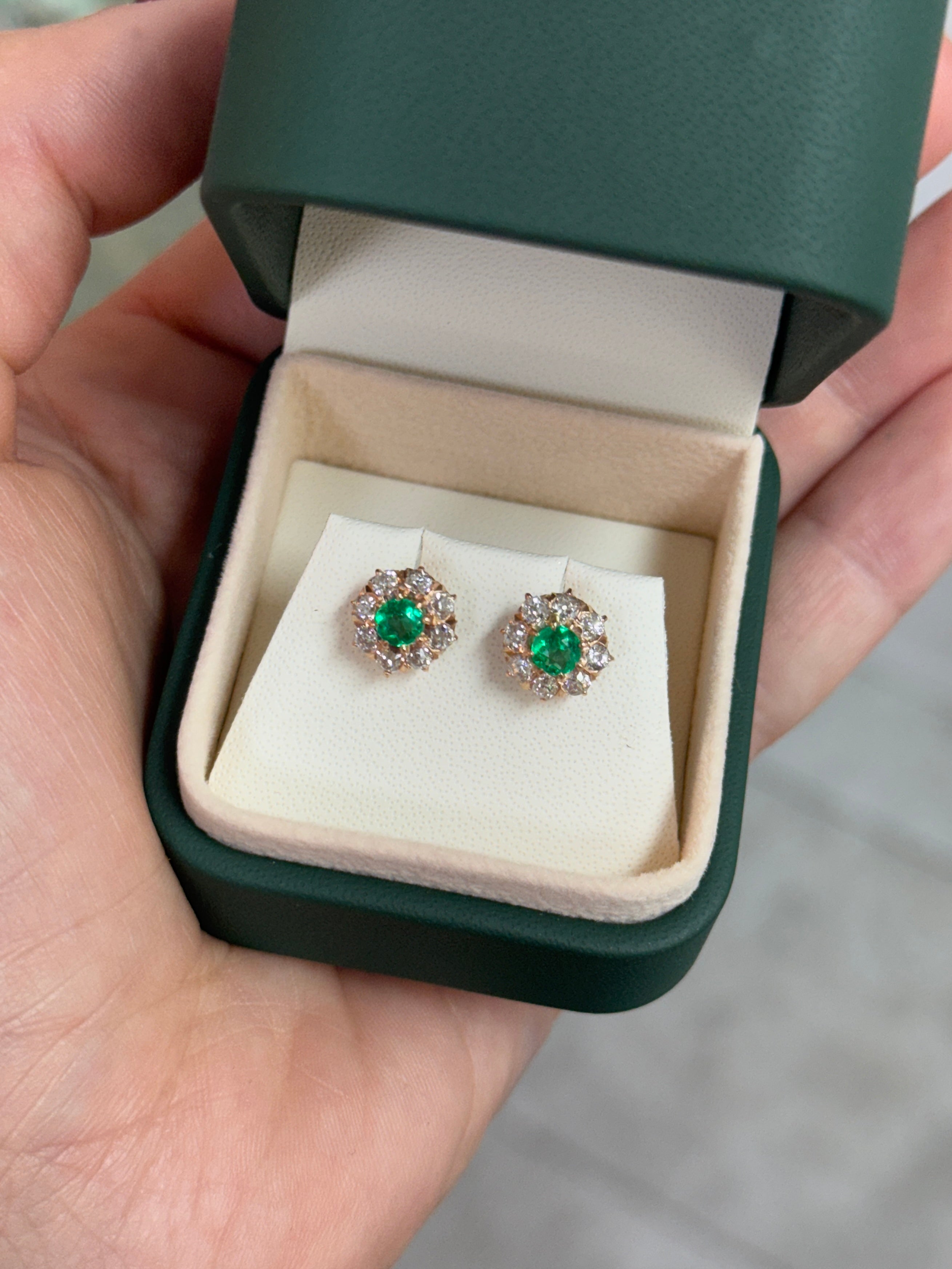 Vivid Colombian emerald halo stud earrings with old European cut diamonds in 14K gold by JR Colombian Emeralds.