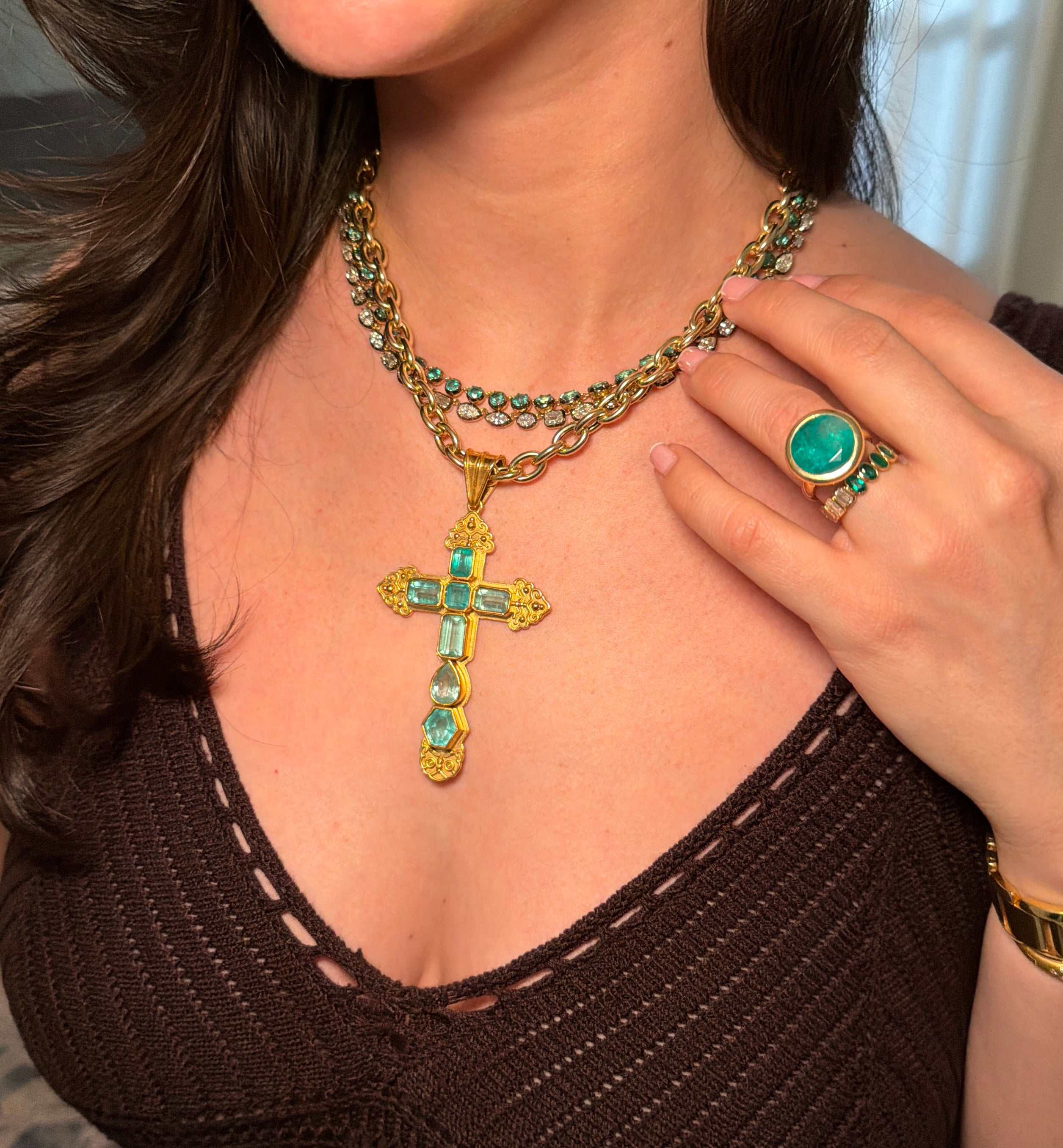 11.33ct Colombian emerald round bezel engagement ring in 18K inspired gold, featuring a striking central emerald stone.