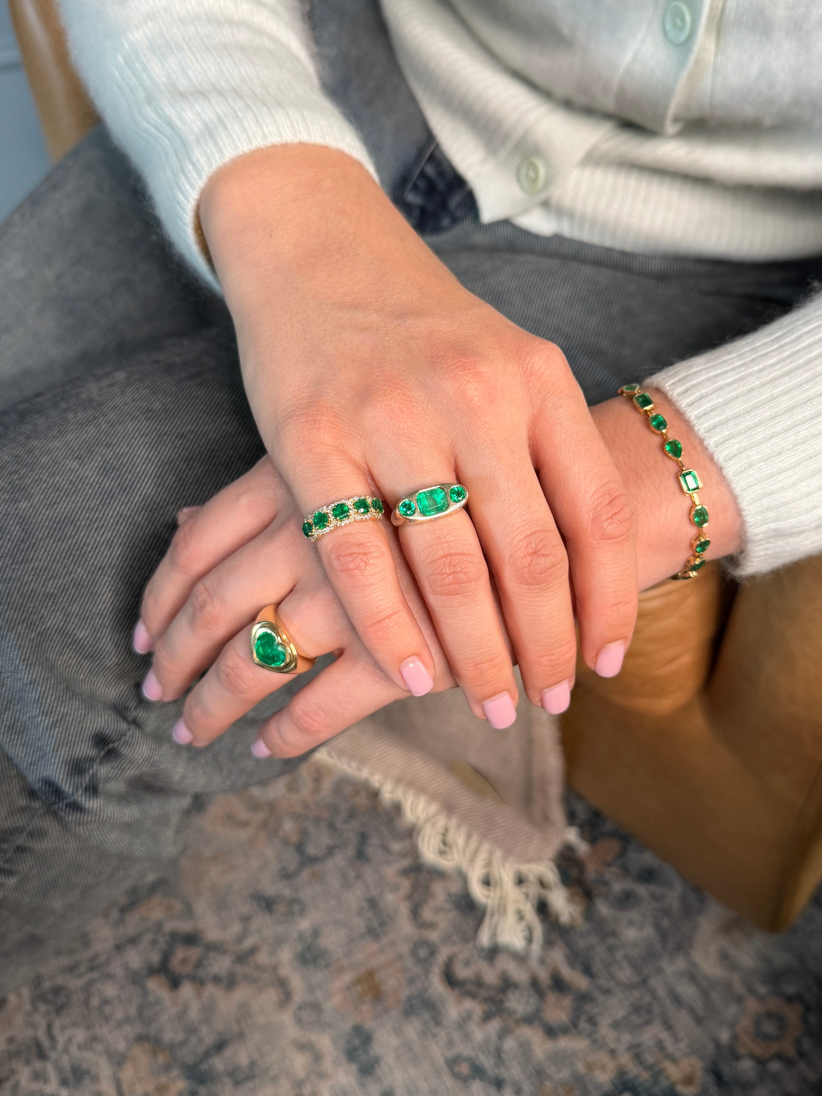 14K Colombian Emerald three-stone diamond ring with round cut emeralds and diamonds, elegant jewelry for special occasions.