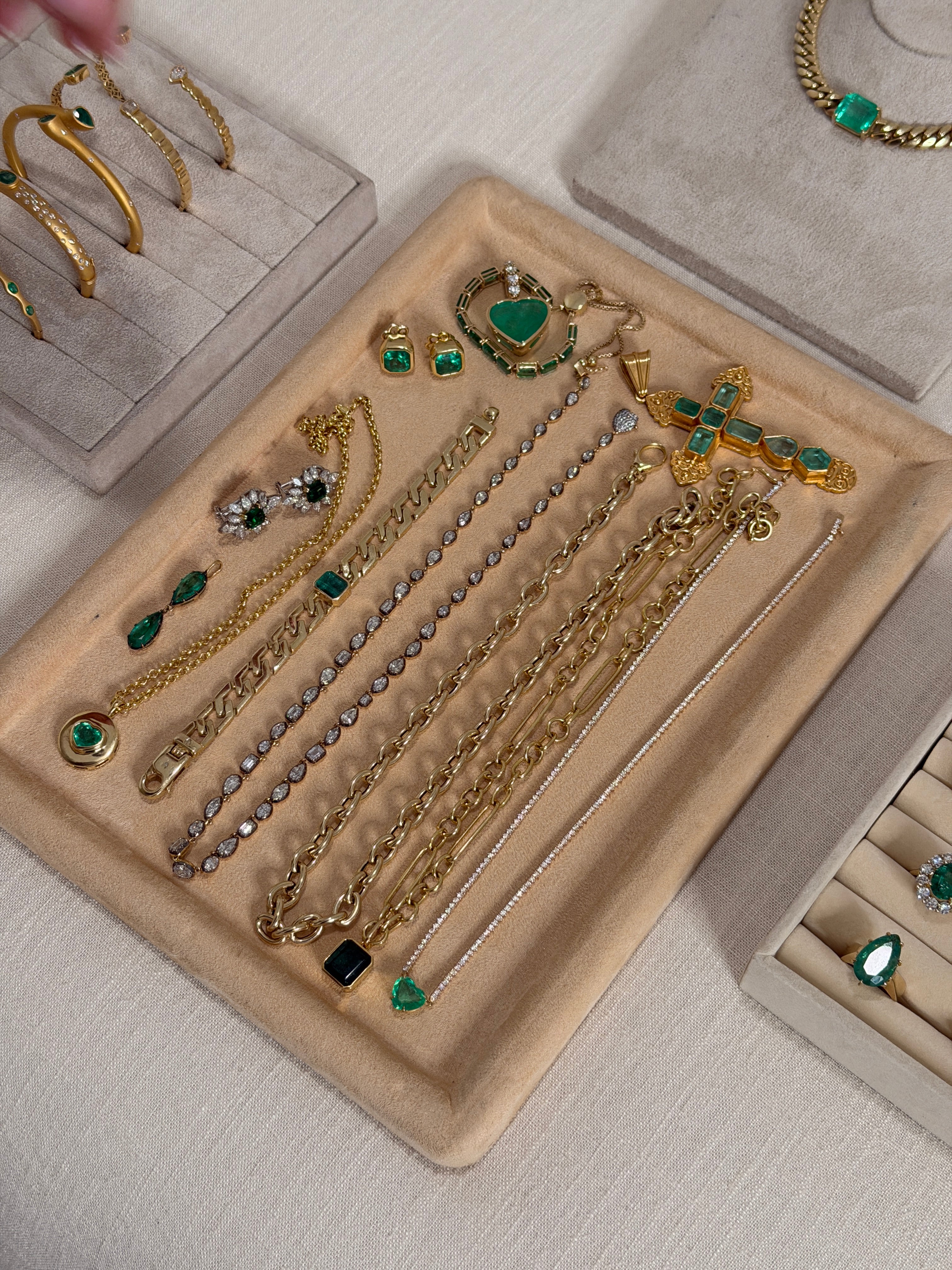 Colombian emerald heart-shaped signet pendant with 18K gold setting, showcasing vibrant green gemstones and intricate design.